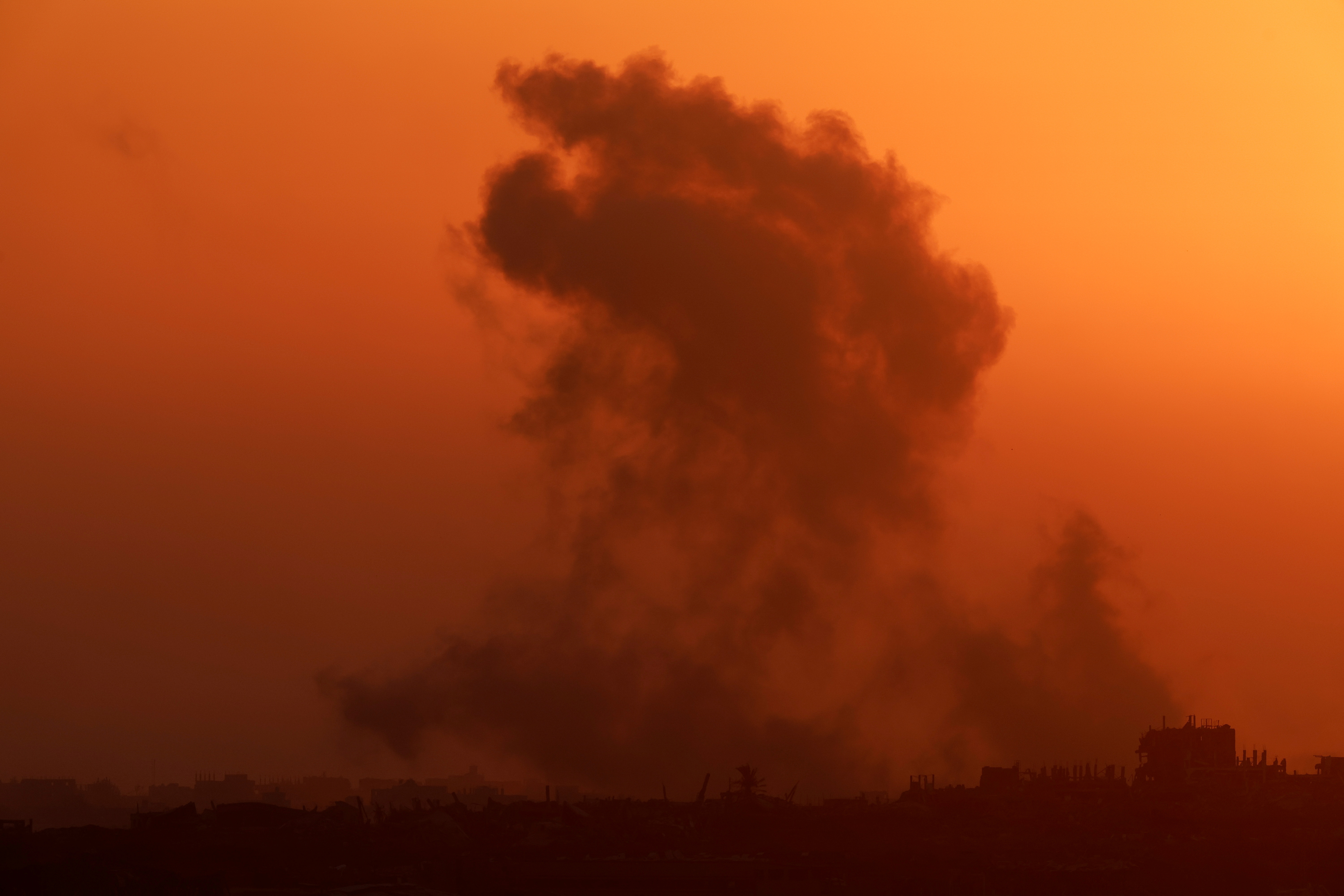 An explosion is seen following an Israeli air strike in Gaza, amid the ongoing conflict between Israel and the Palestinian Islamist group Hamas, as seen from Israel