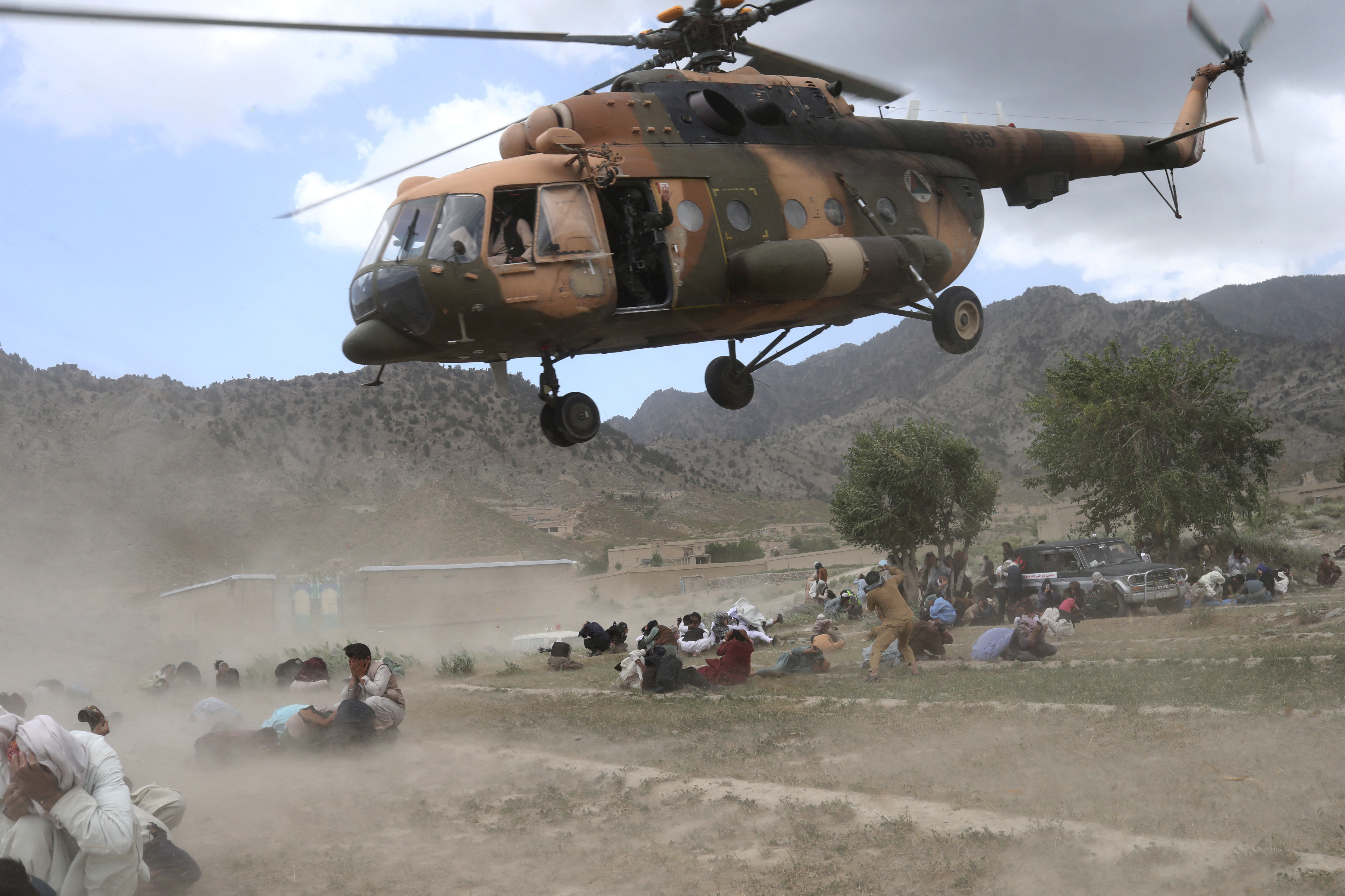 A Taliban helicopter takes off after bringing aid to an area affected by an earthquake in Gayan