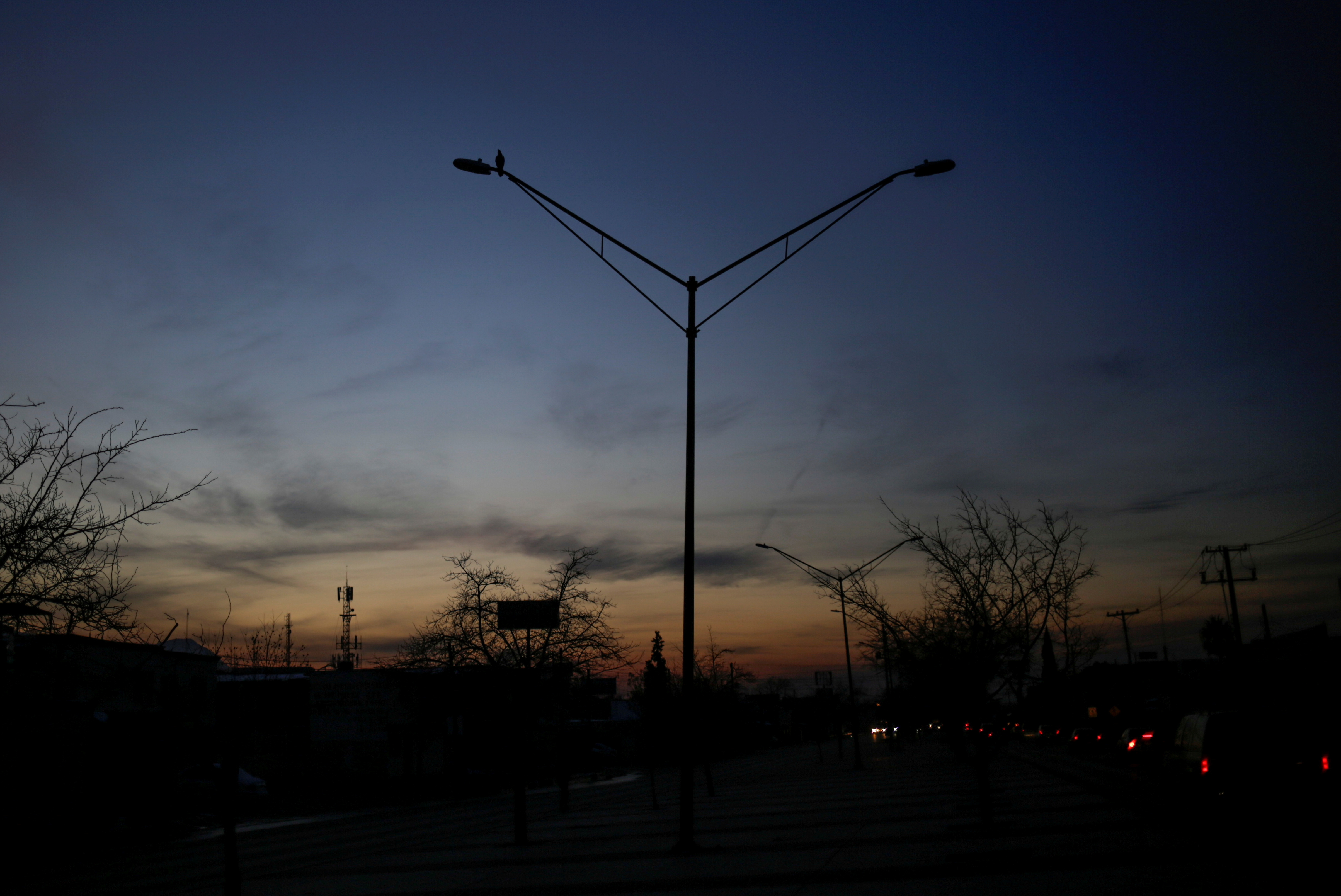 Light poles are pictured without power during an outage in Mexico's electricity network, in Ciudad Juarez