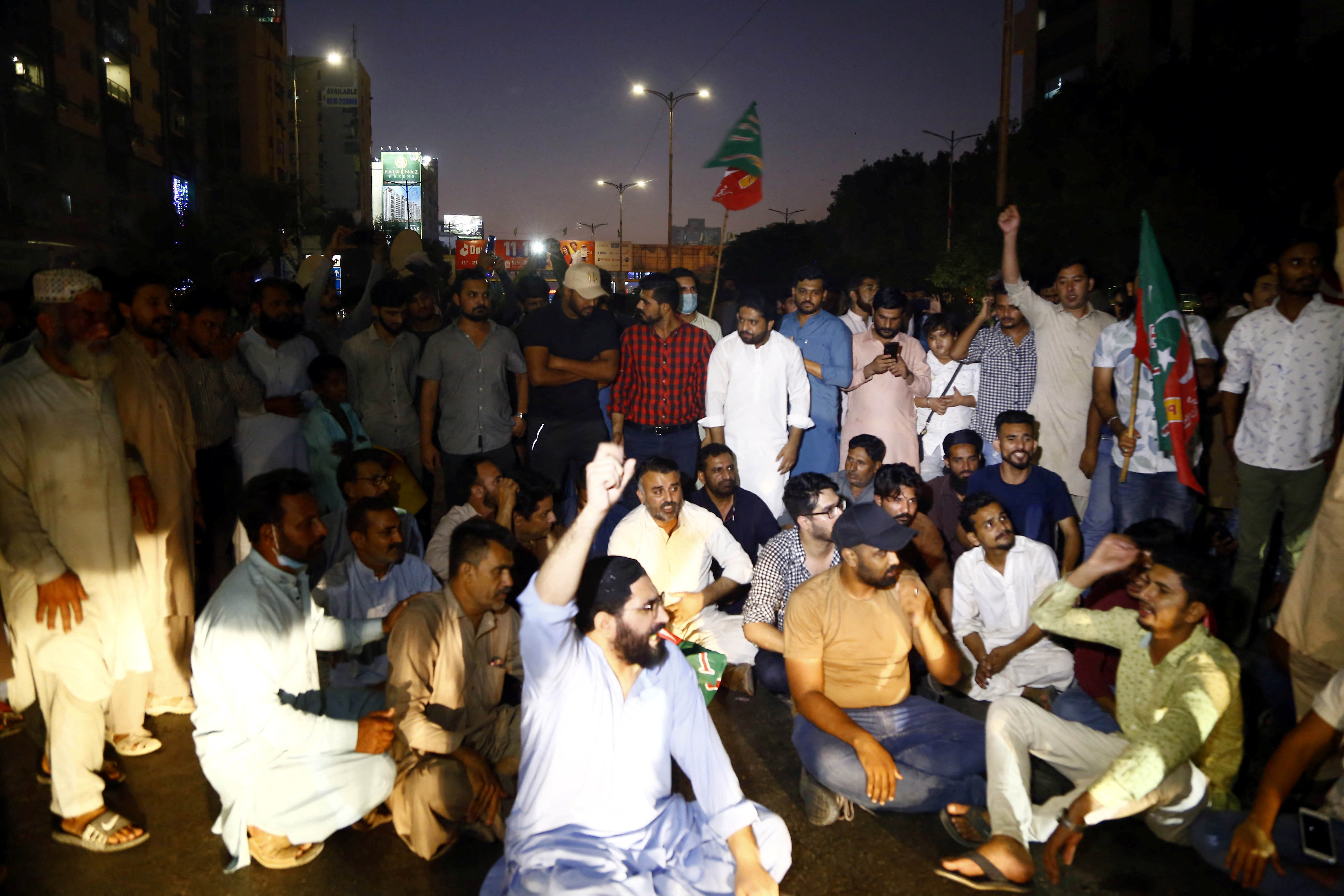 Supporters of Pakistan former Prime Minister Imran Khan, protest following the shooting incident on his long march in Wazirabad, in Karachi,