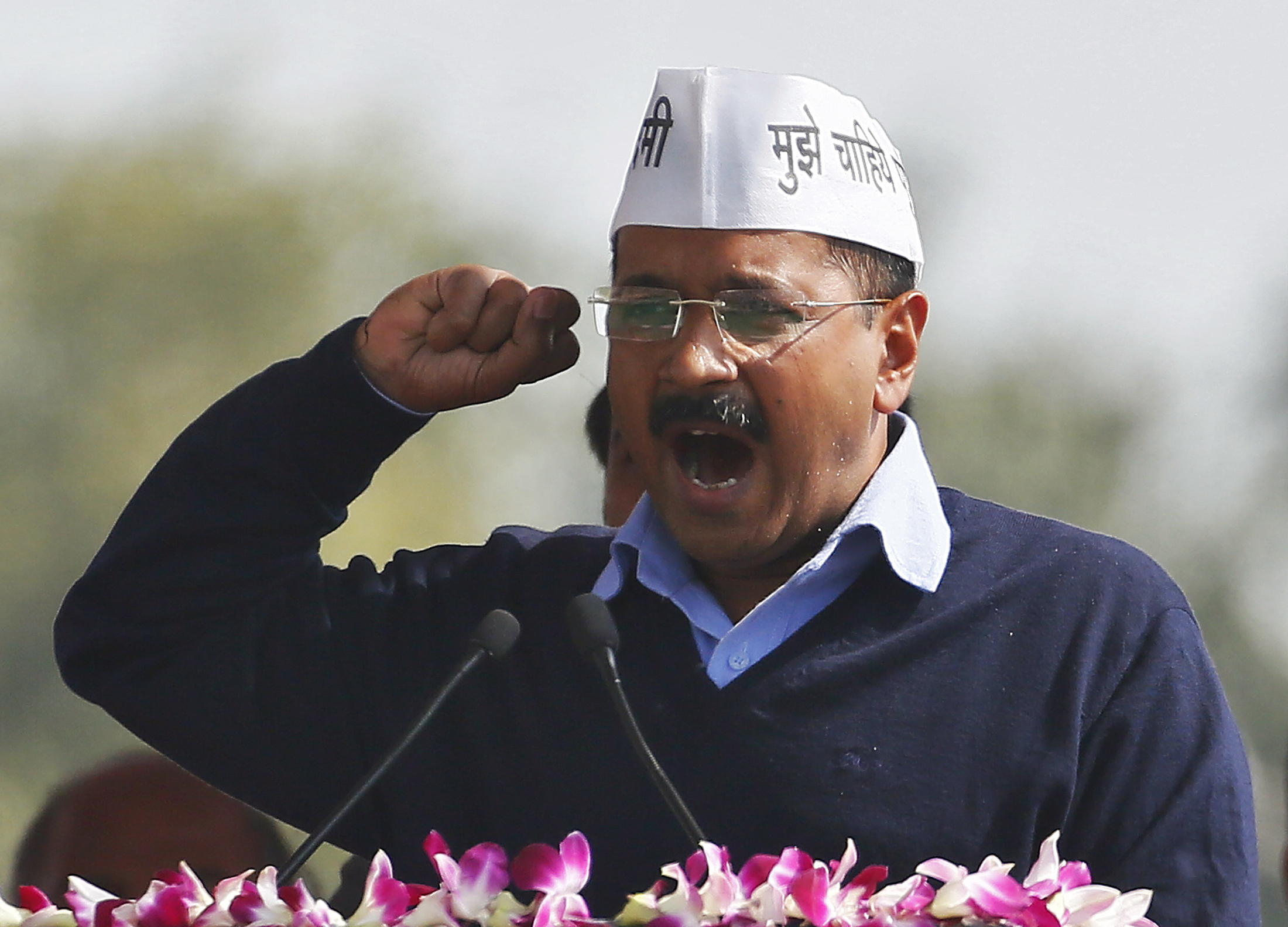 Kejriwal, chief of AAP, addresses his supporters after taking the oath as the new chief minister of Delhi during a swearing-in ceremony at Ramlila ground in New Delhi