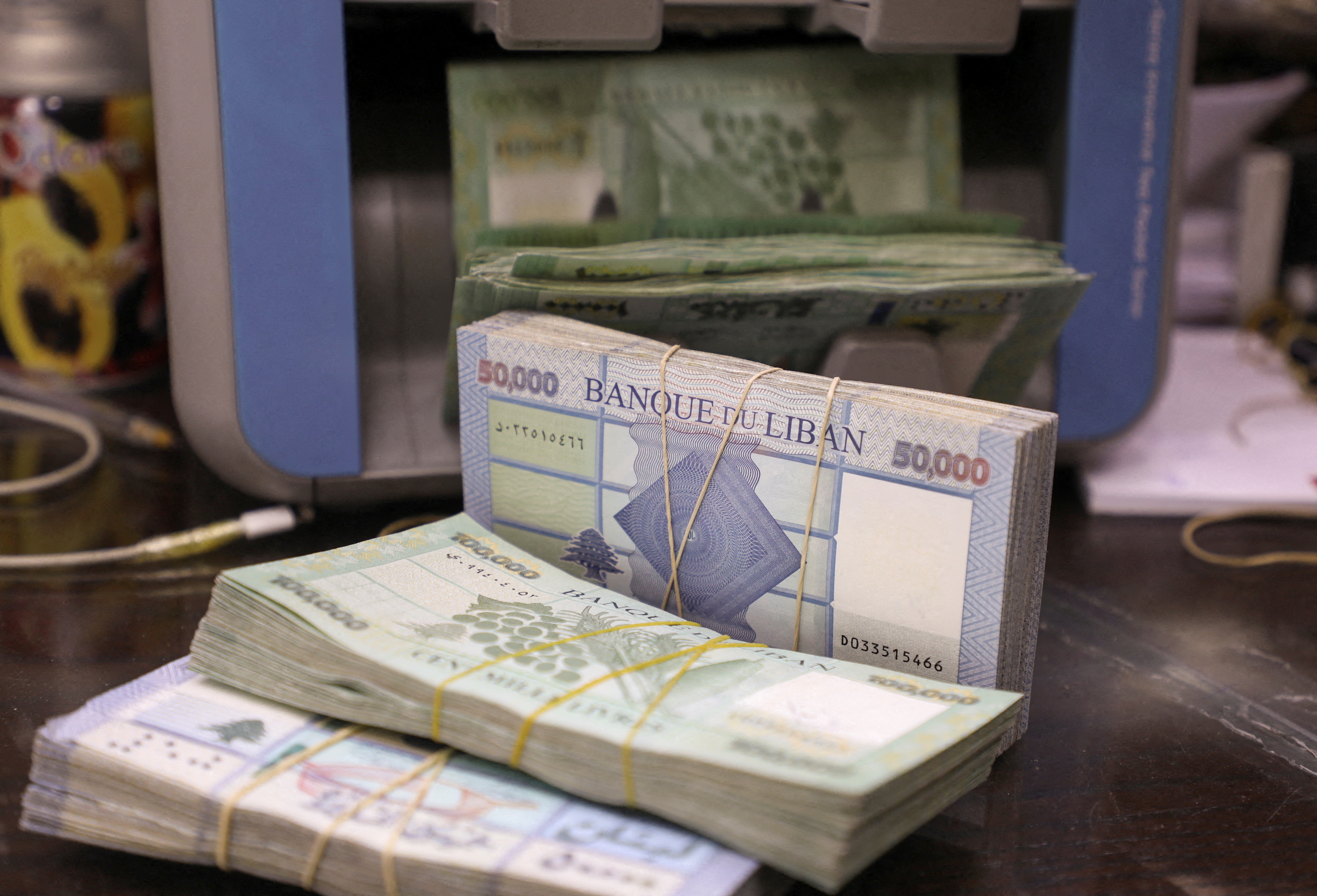 Lebanese pound banknotes are pictured at a currency exchange shop in Beirut