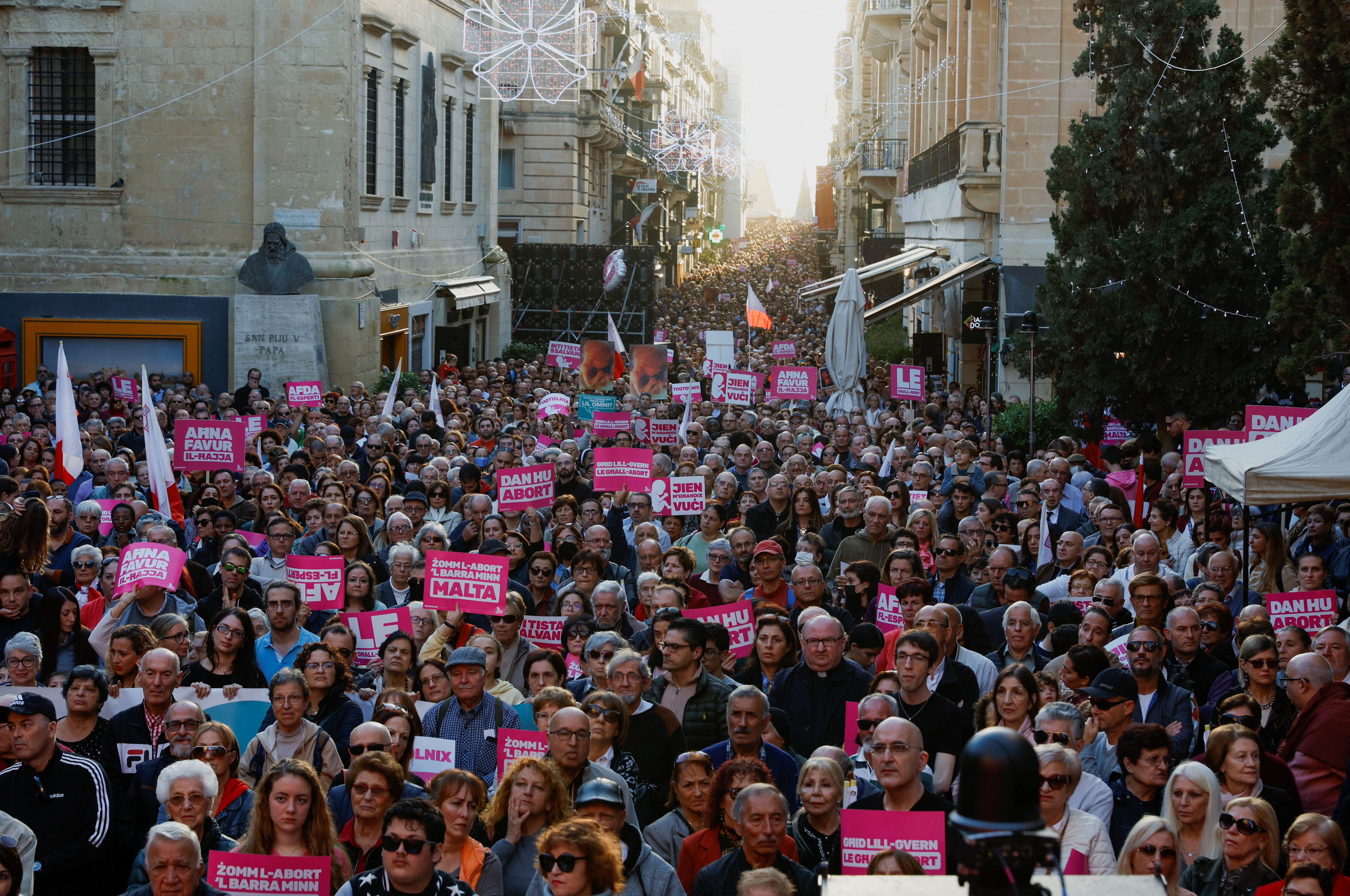 People protest against government plans to introduce an abortion law in Valletta
