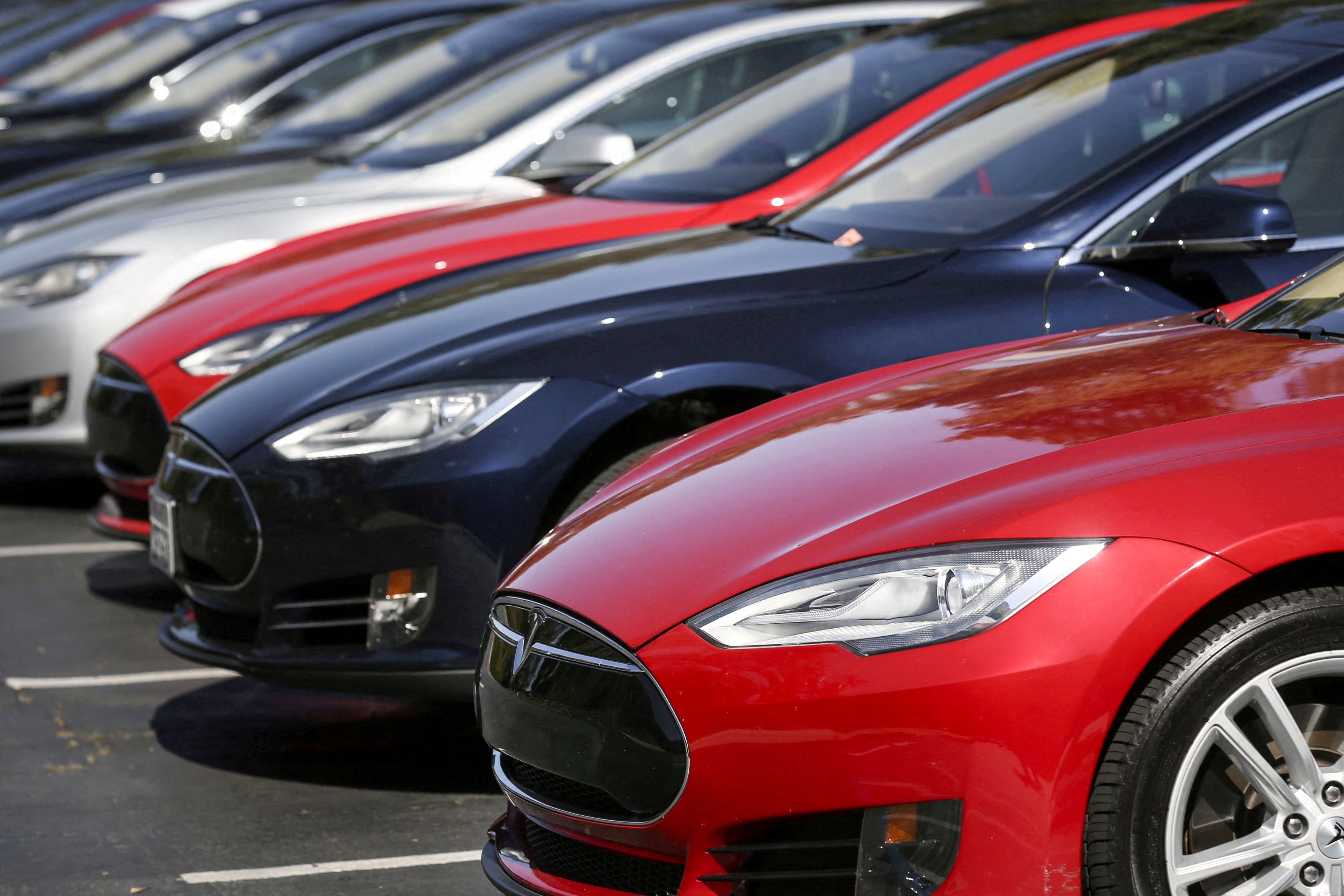 Row of Tesla Model S sedans are seen outside the company's headquarters in Palo Alto, California