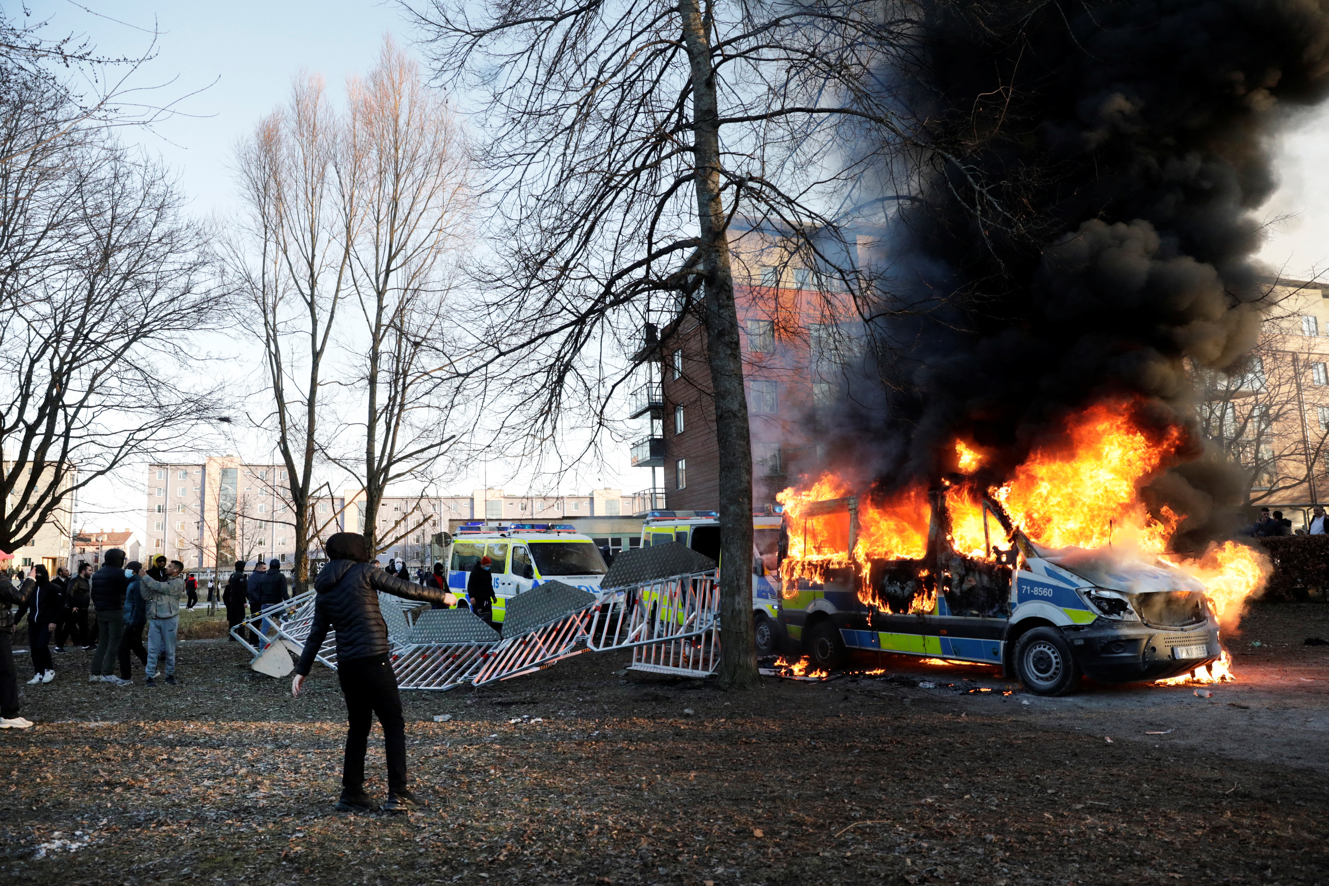 Counter-protesters set fire to a police bus ahead of a demonstration planned by Danish anti-Muslim politician Rasmus Paludan