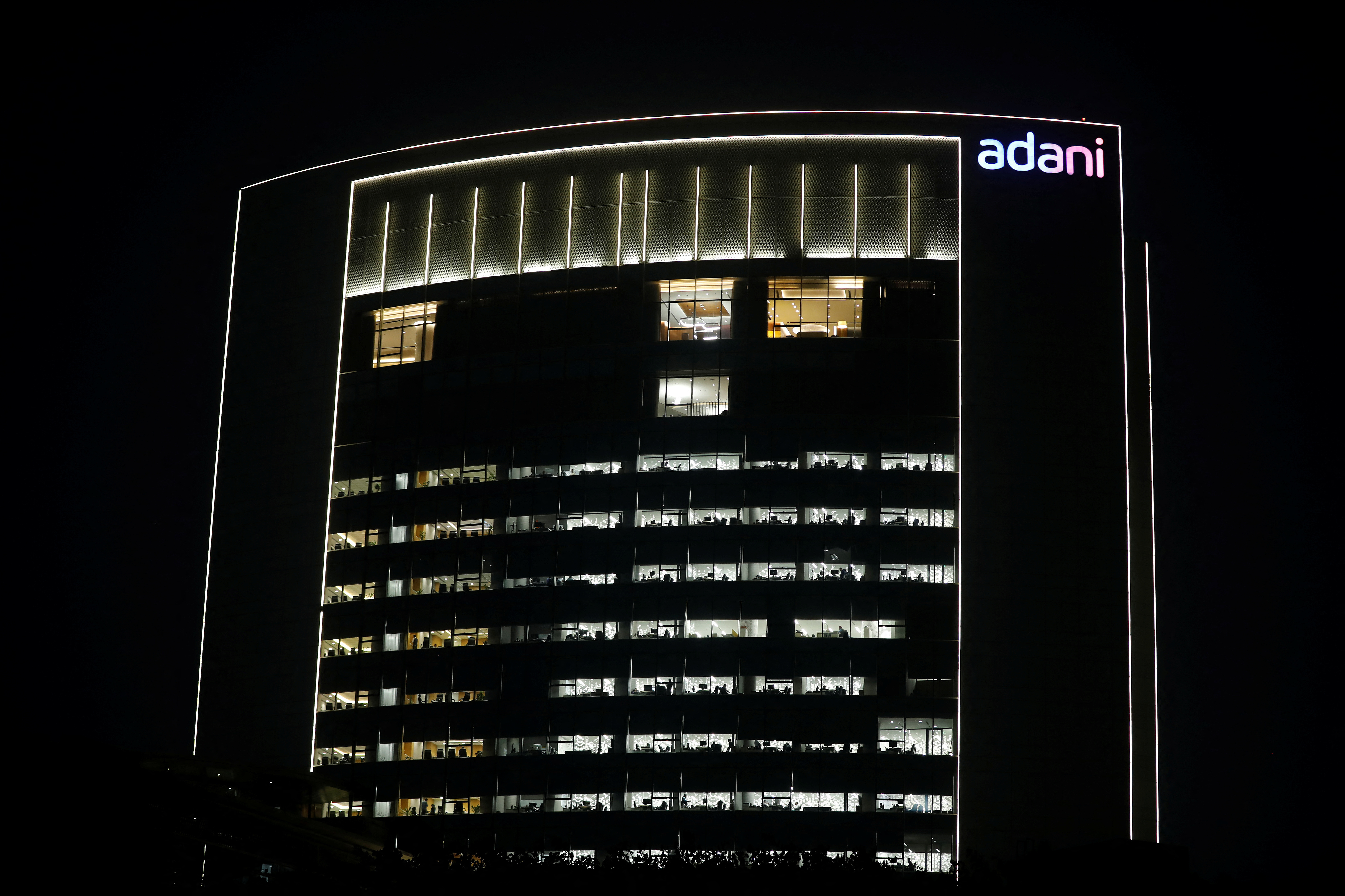 The logo of the Adani Group is seen on the facade of its Corporate House on the outskirts of Ahmedabad