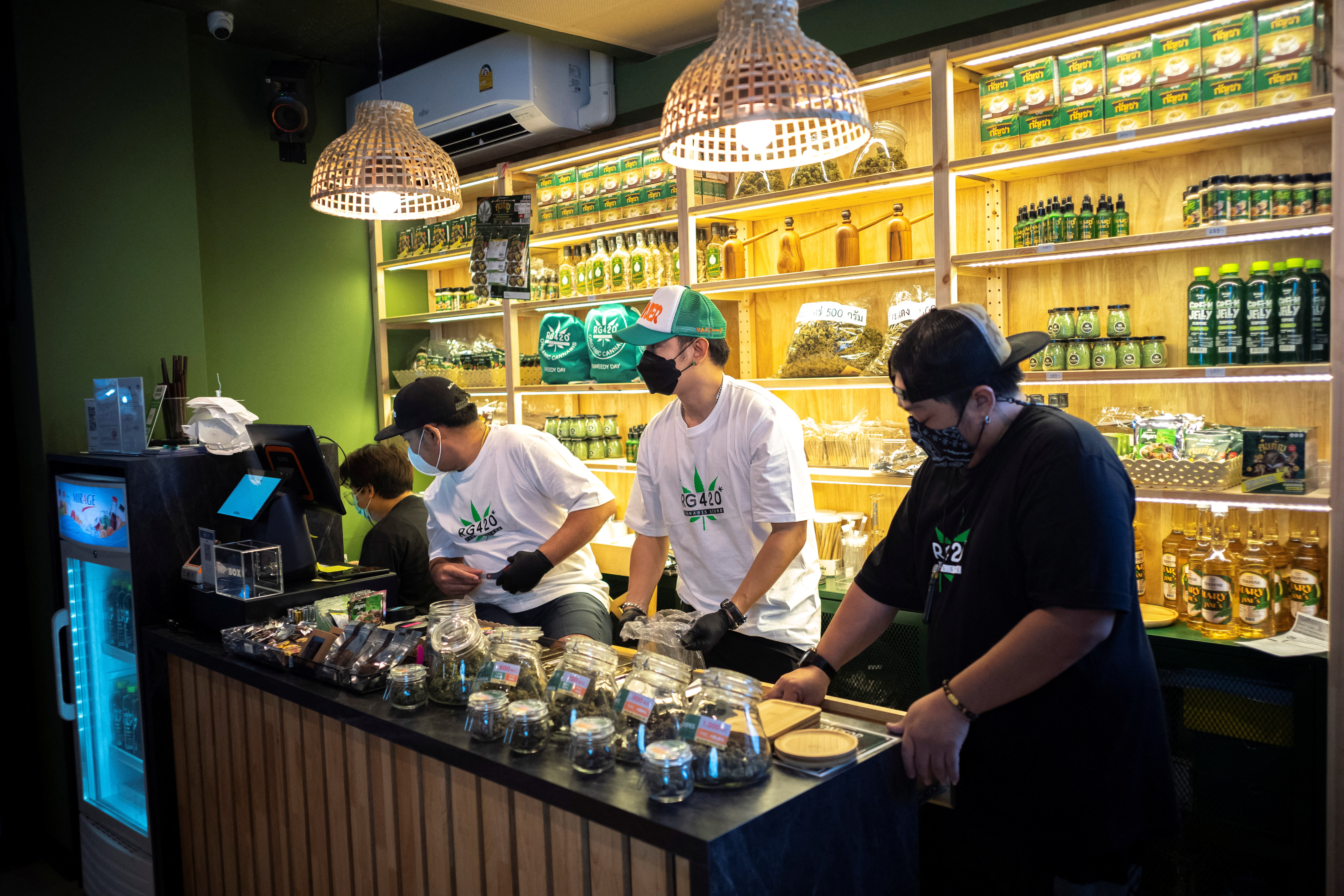Staff members prepare cannabis at the RG420 cannabis store, at Khaosan Road, one of the favourite tourist spots in Bangkok