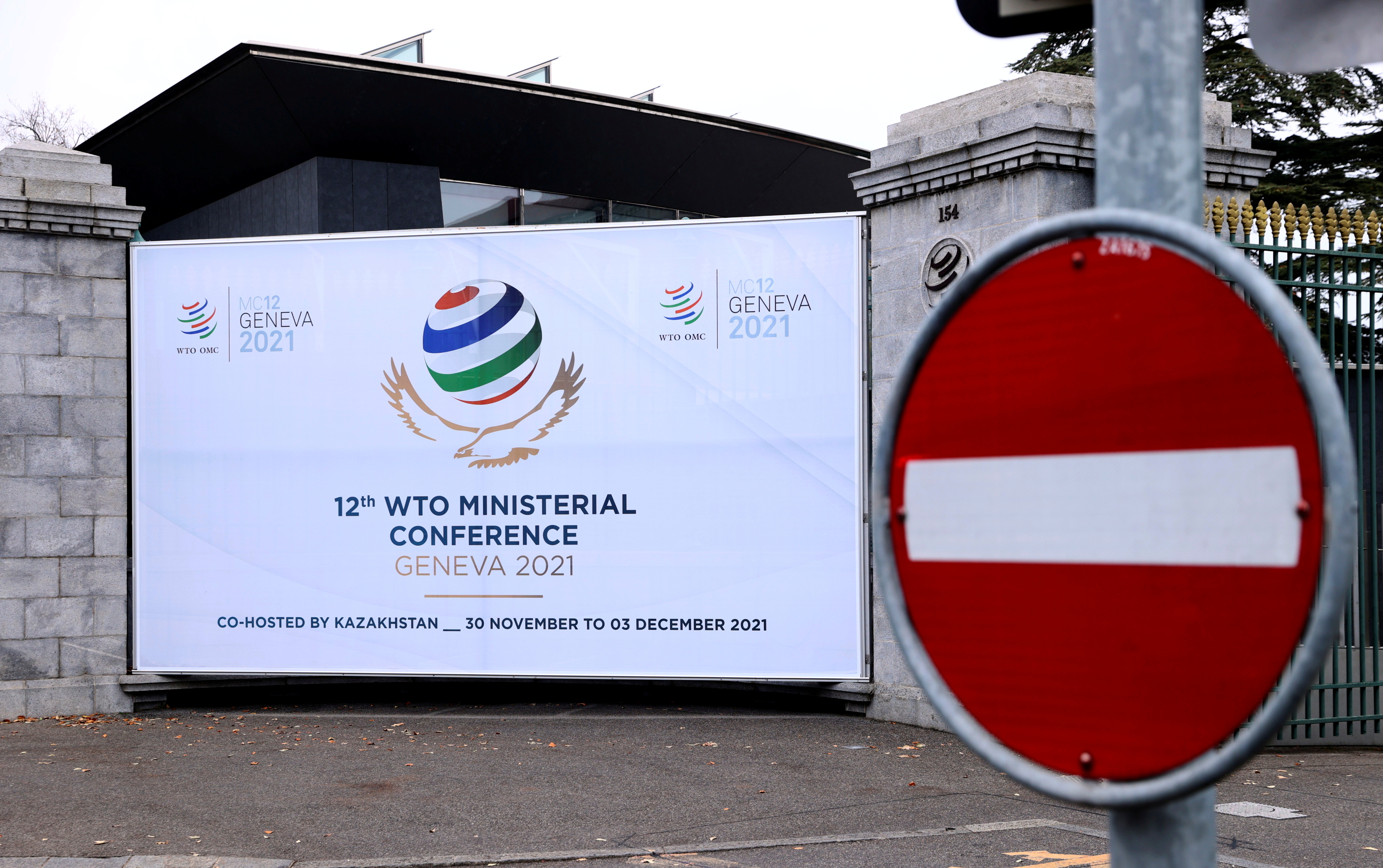 A sign of the 12th Ministerial Conference (MC12) is pictured at the WTO headquarters in Geneva