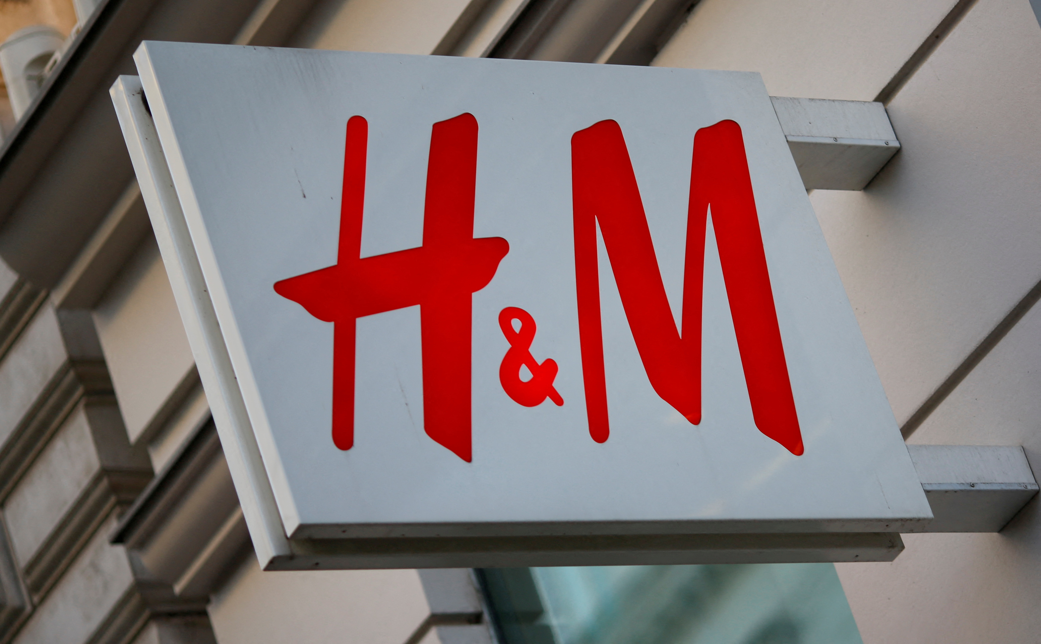 The logo of Swedish fashion label H&M is seen outside a store in Vienna