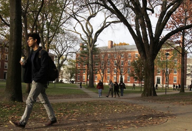 A man walks through Harvard Yard at Harvard University in Cambridge