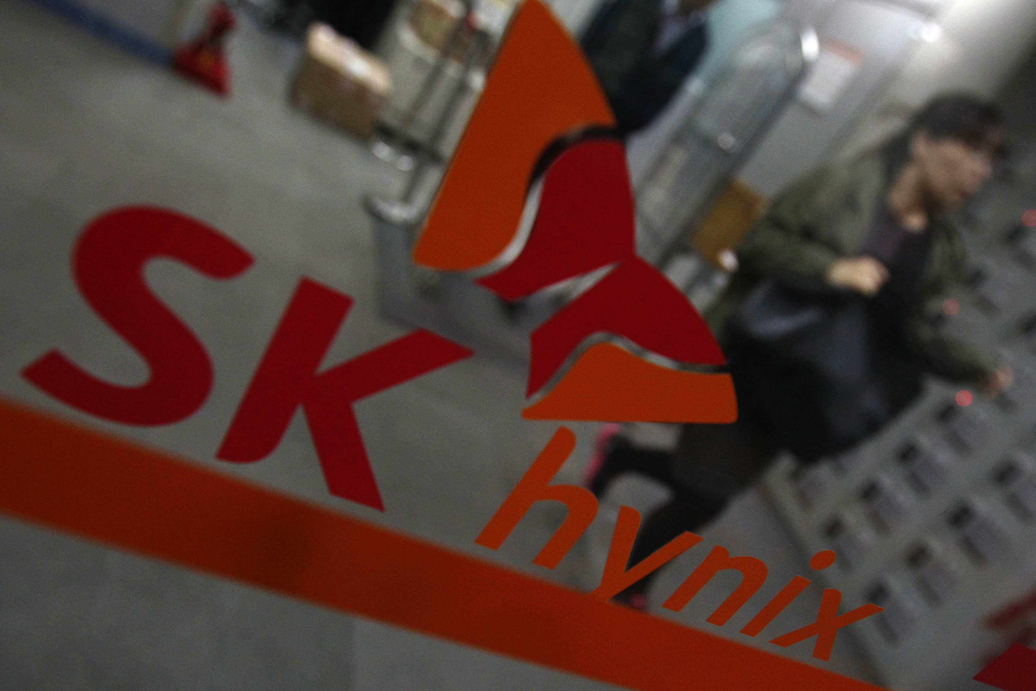Employees of SK Hynix walk at the company's main office building in Seoul