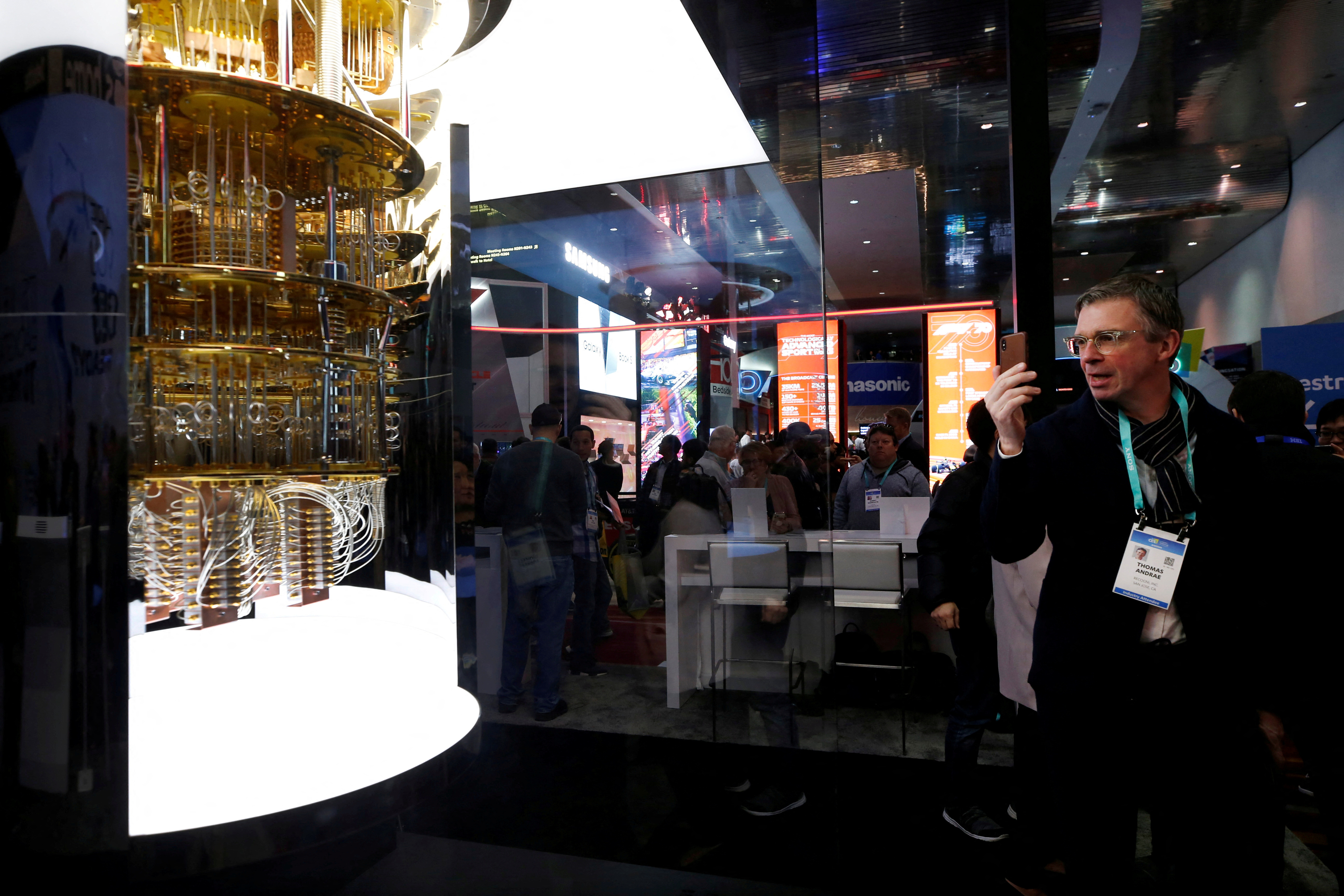 A man takes a photo of a model of the IBM Q System One quantum computer during the 2020 CES in Las Vegas