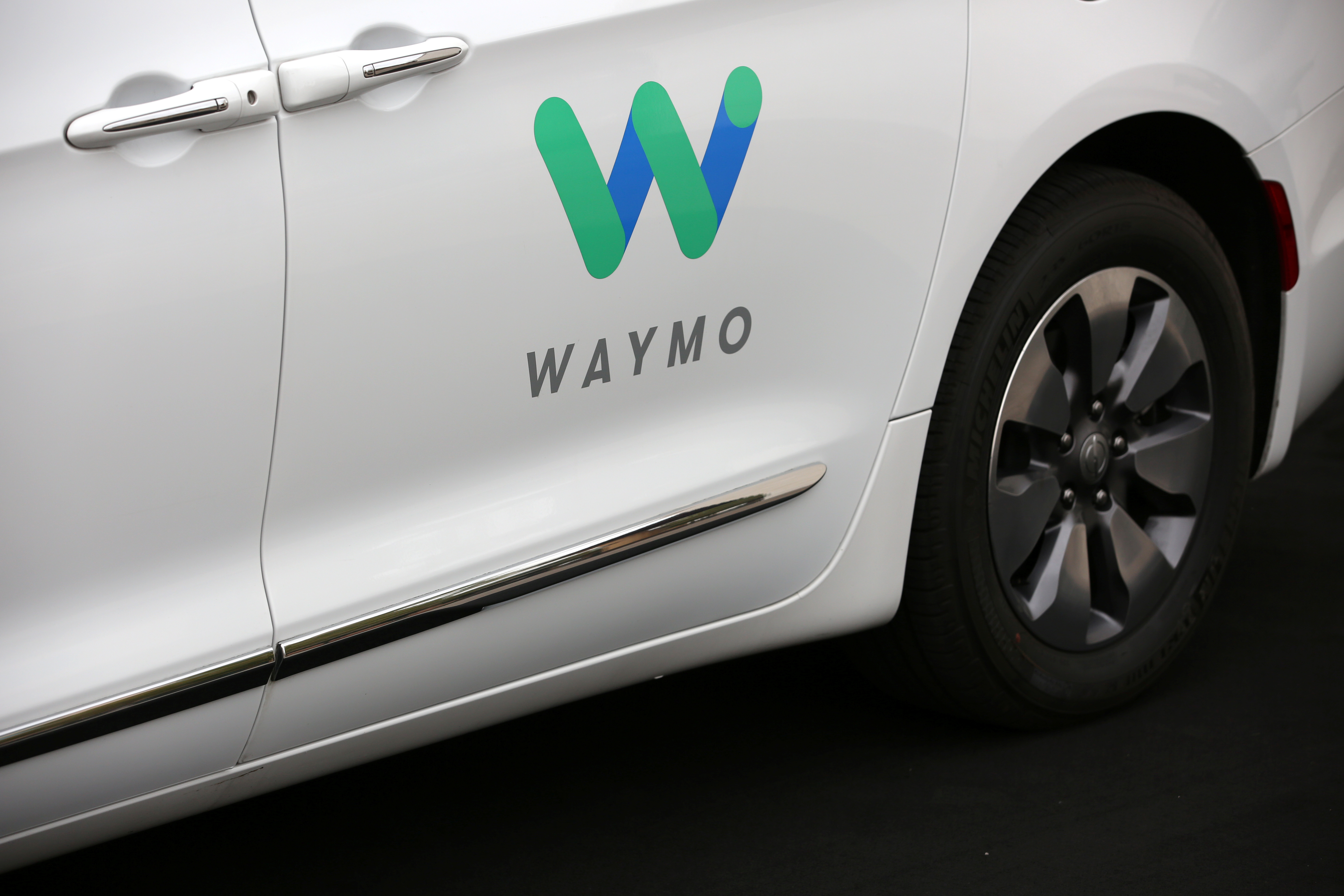 A Waymo Chrysler Pacifica Hybrid self-driving vehicle is parked and displayed during a demonstration in Chandler, Arizona