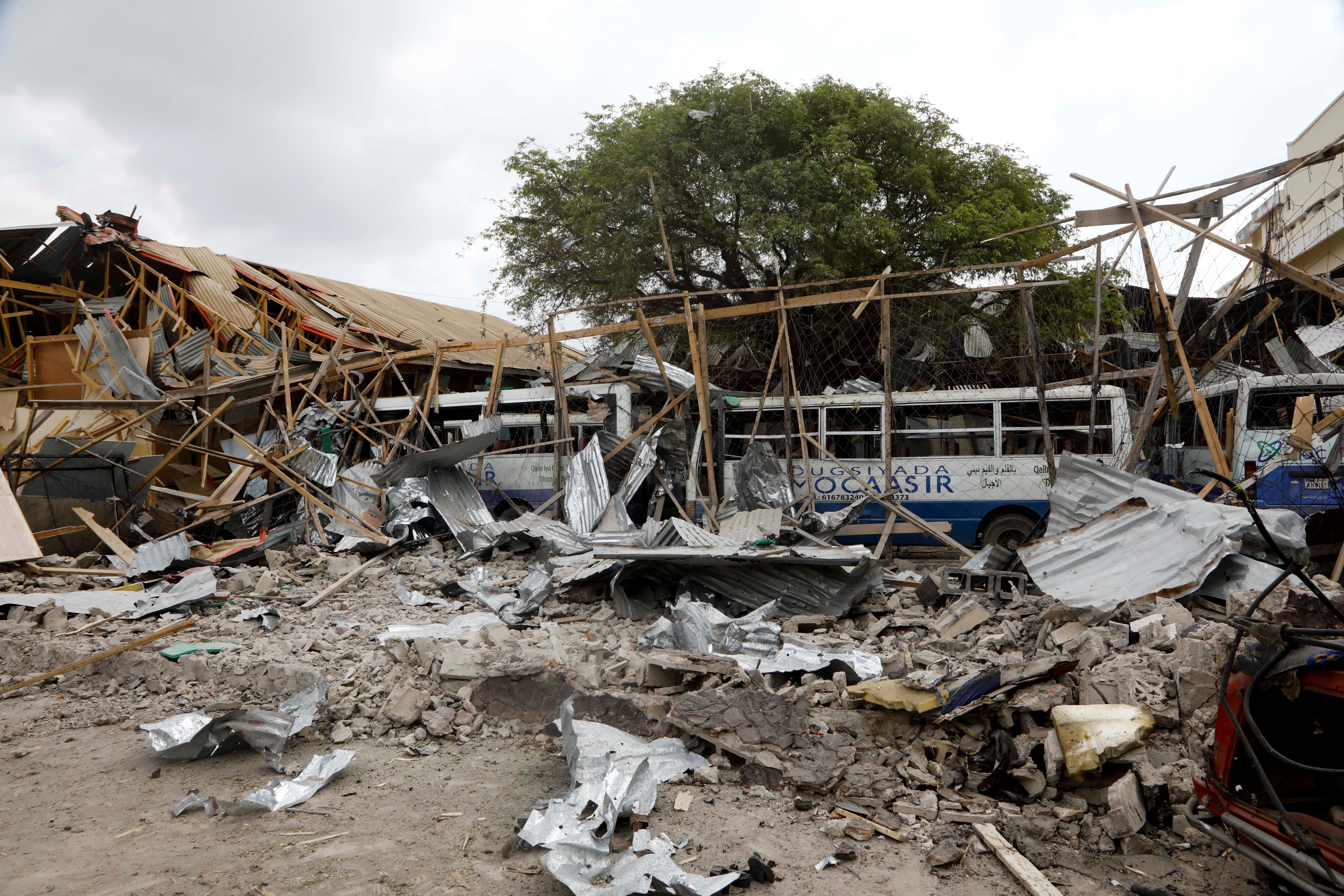 A view shows the damaged structures and school buses at the scene after a car exploded in a suicide attack near Mucassar primary and secondary school in Hodan district of Mogadishu