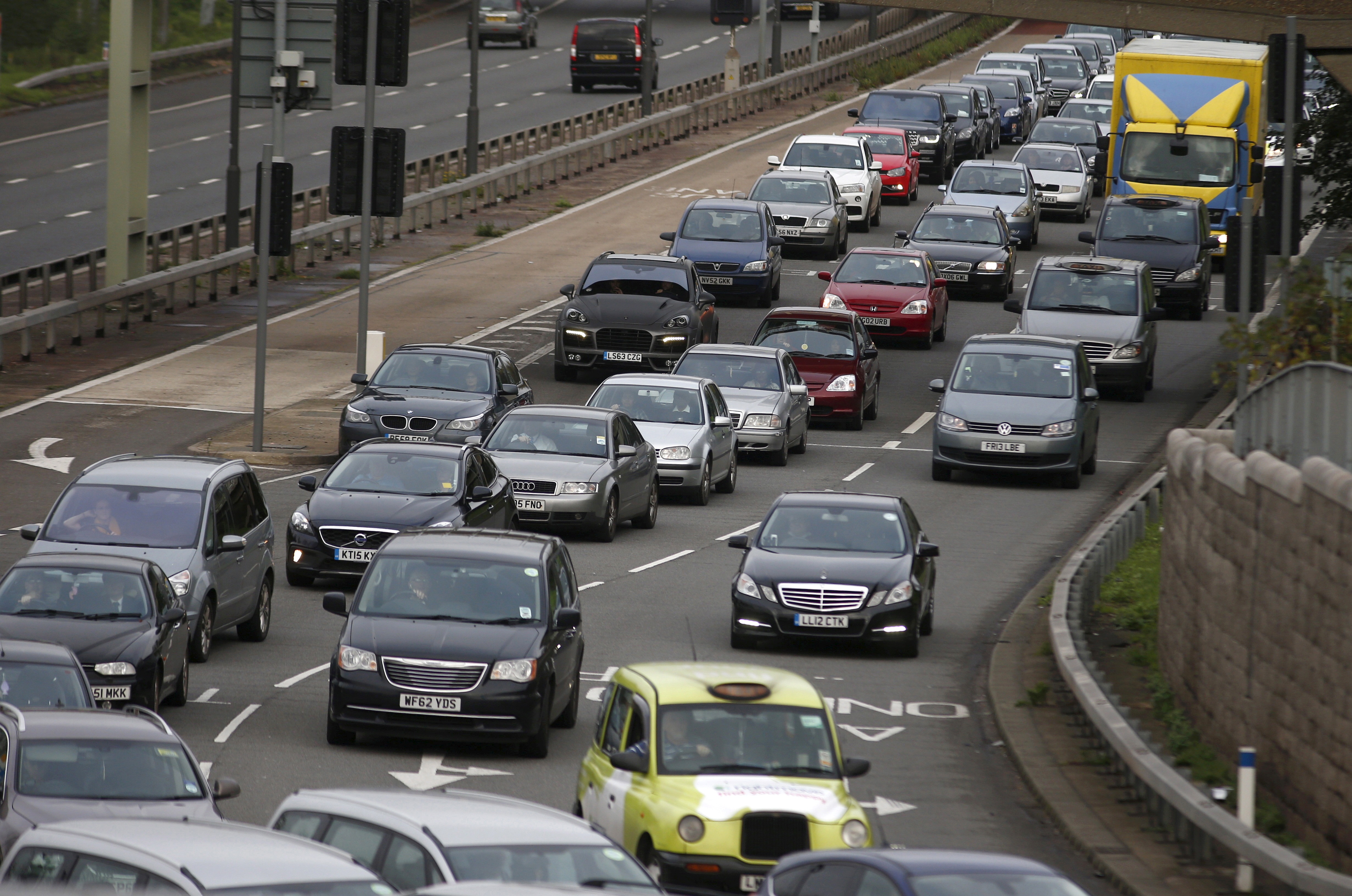 A traffic jam is seen as cars head towards the approach tunnel of Heathrow Airport, west London