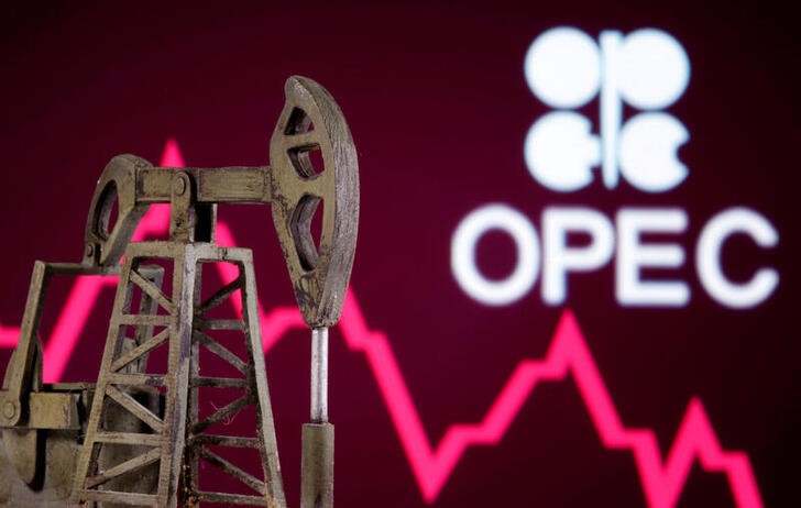 A 3D printed oil pump jack is seen in front of displayed stock graph and Opec logo in this illustration picture