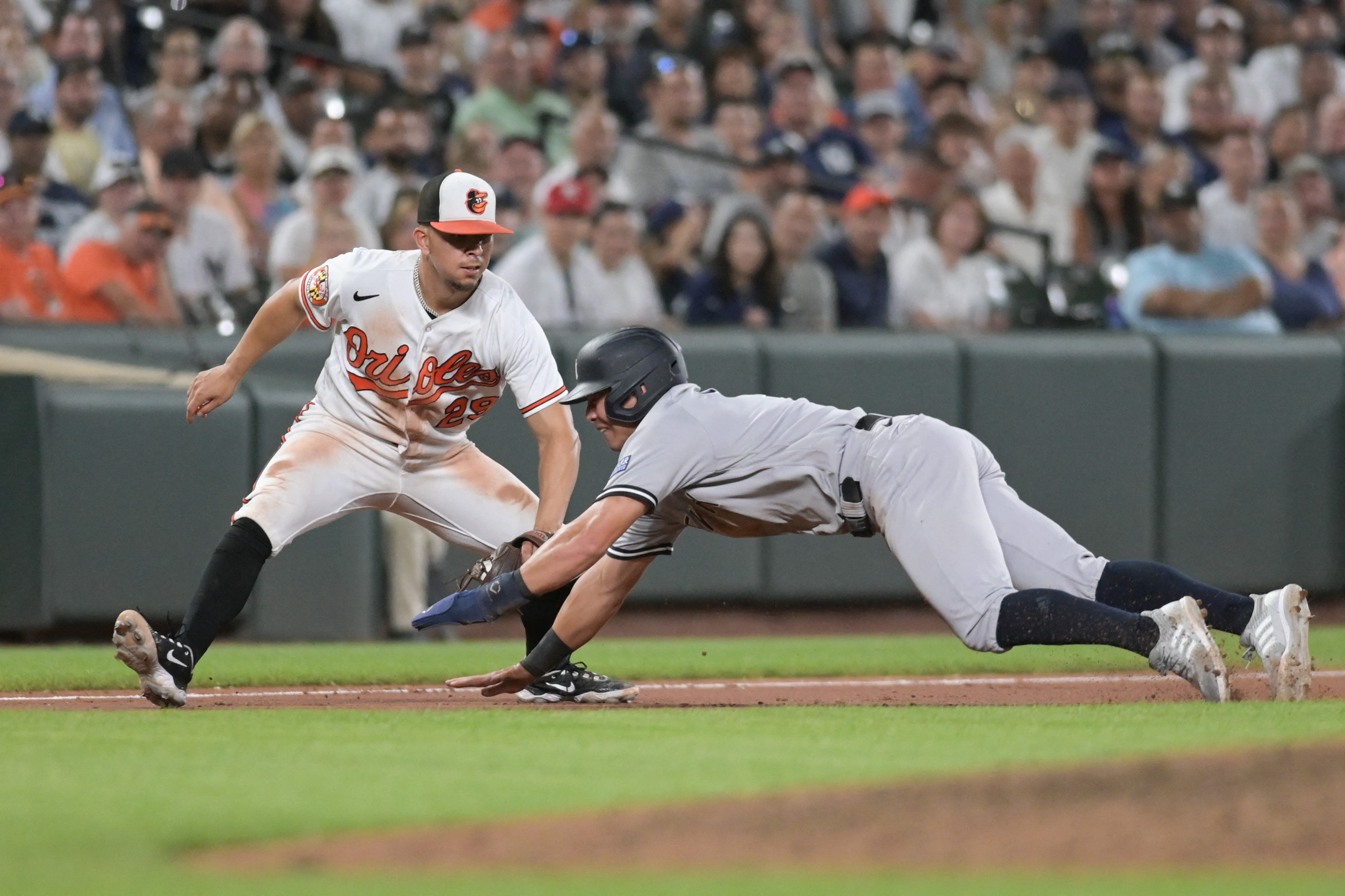 Dyersville, United States. 12th Aug, 2021. New York Yankees' Aaron Judge  (99) celebrates with Rougned Odor (12) after a three-run homer against the  Chicago White Sox during the third inning of the