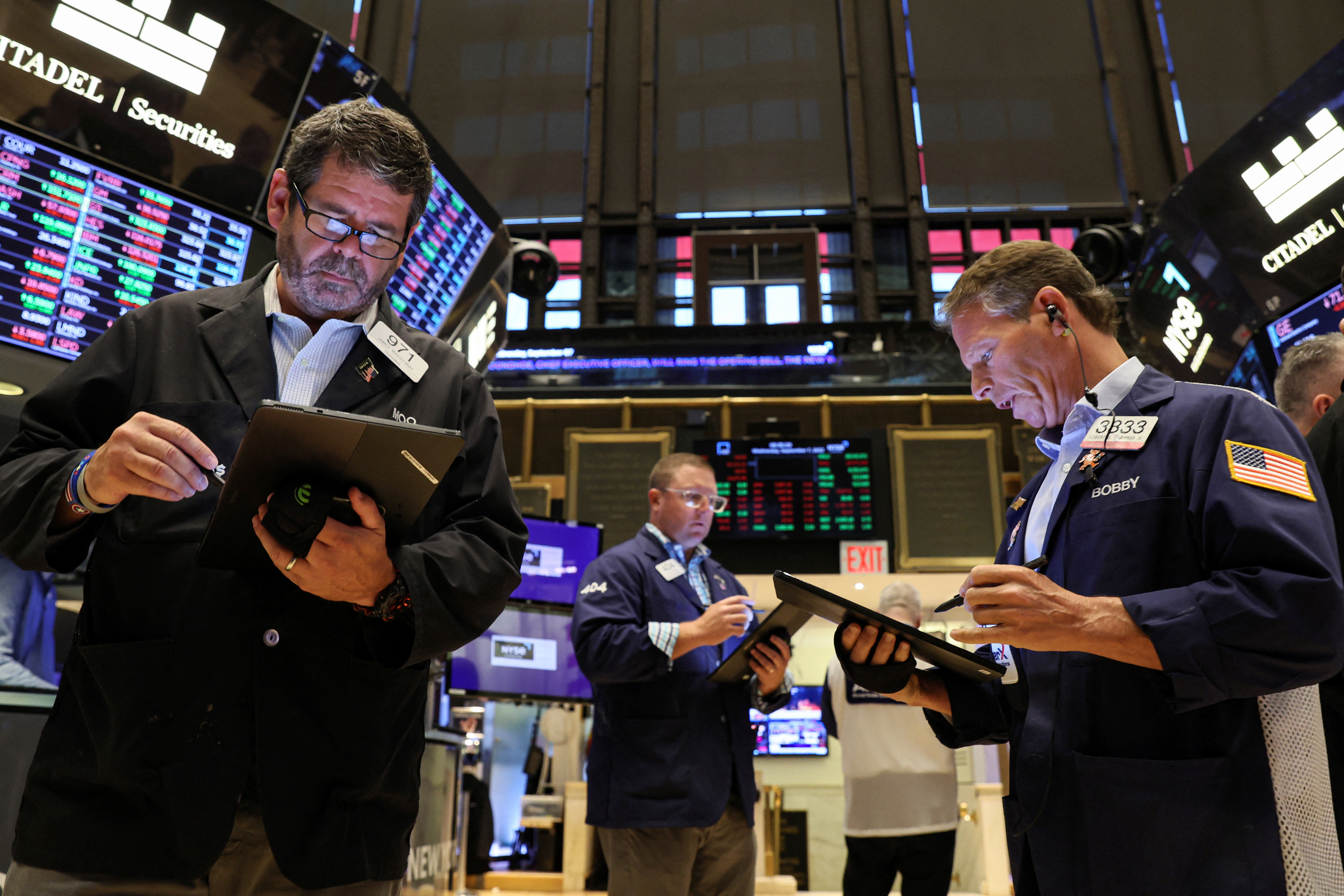 Traders work on the floor of the New York Stock Exchange in New York