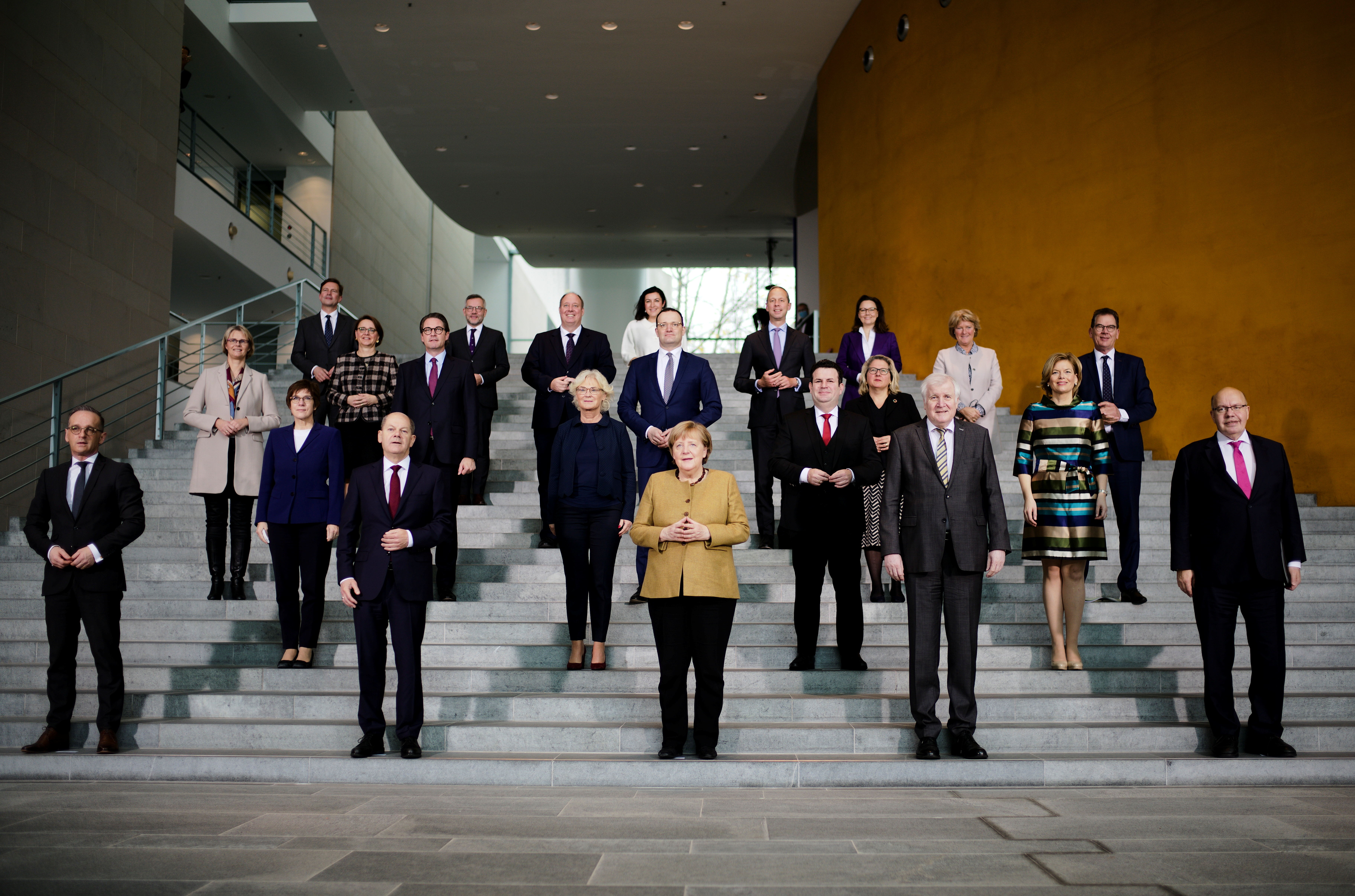 Acting German Chancellor Angela Merkel poses with her government after the weekly cabinet meeting at the Chancellery in Berlin, Germany, November 24, 2021. Markus Schreiber/Pool via REUTERS