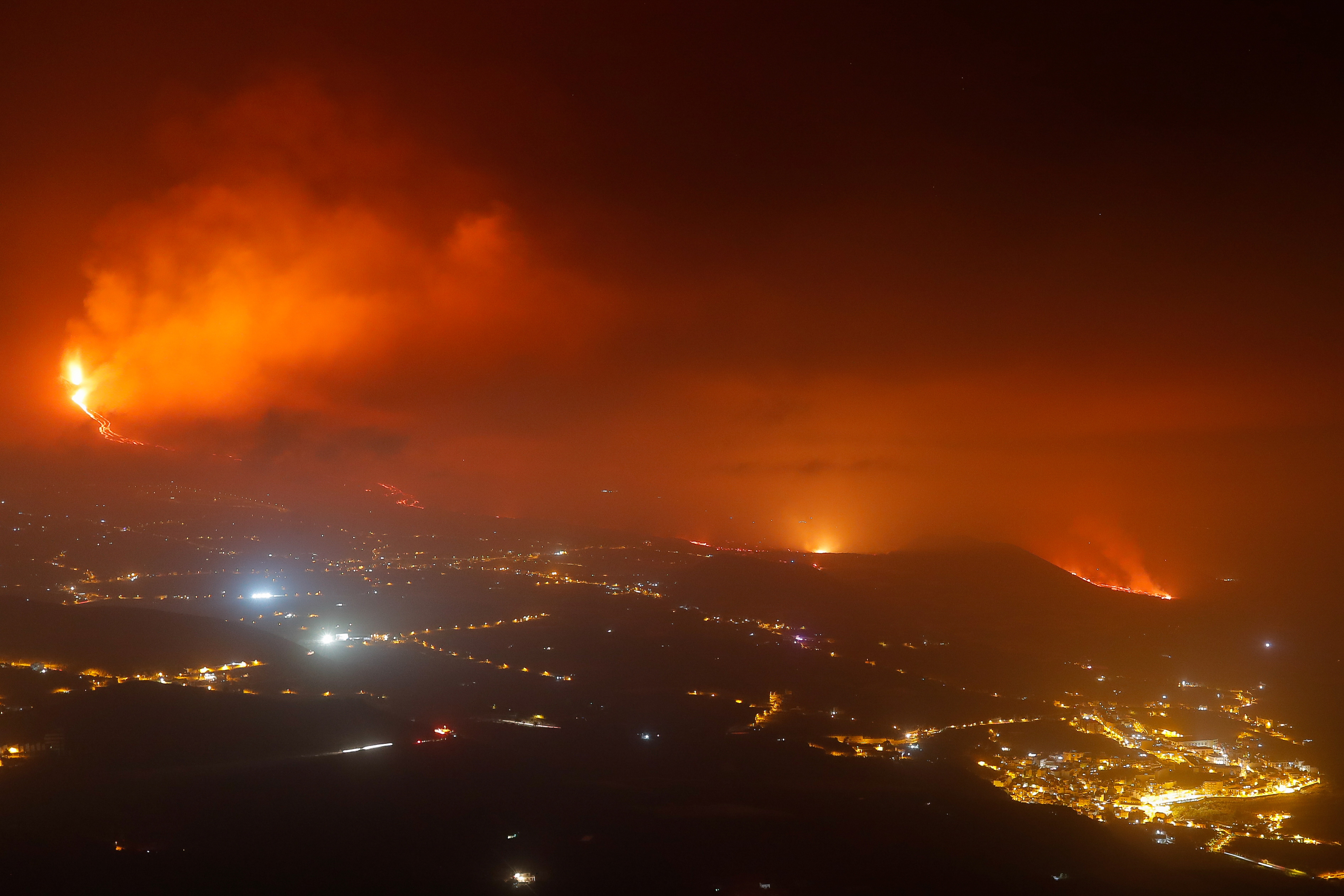 Lava flows towards the coast next to Tazacorte, as seen from Tijarafe, following the eruption of a volcano on the Canary Island of La Palma, Spain, September 28, 2021. REUTERS/Jon Nazca