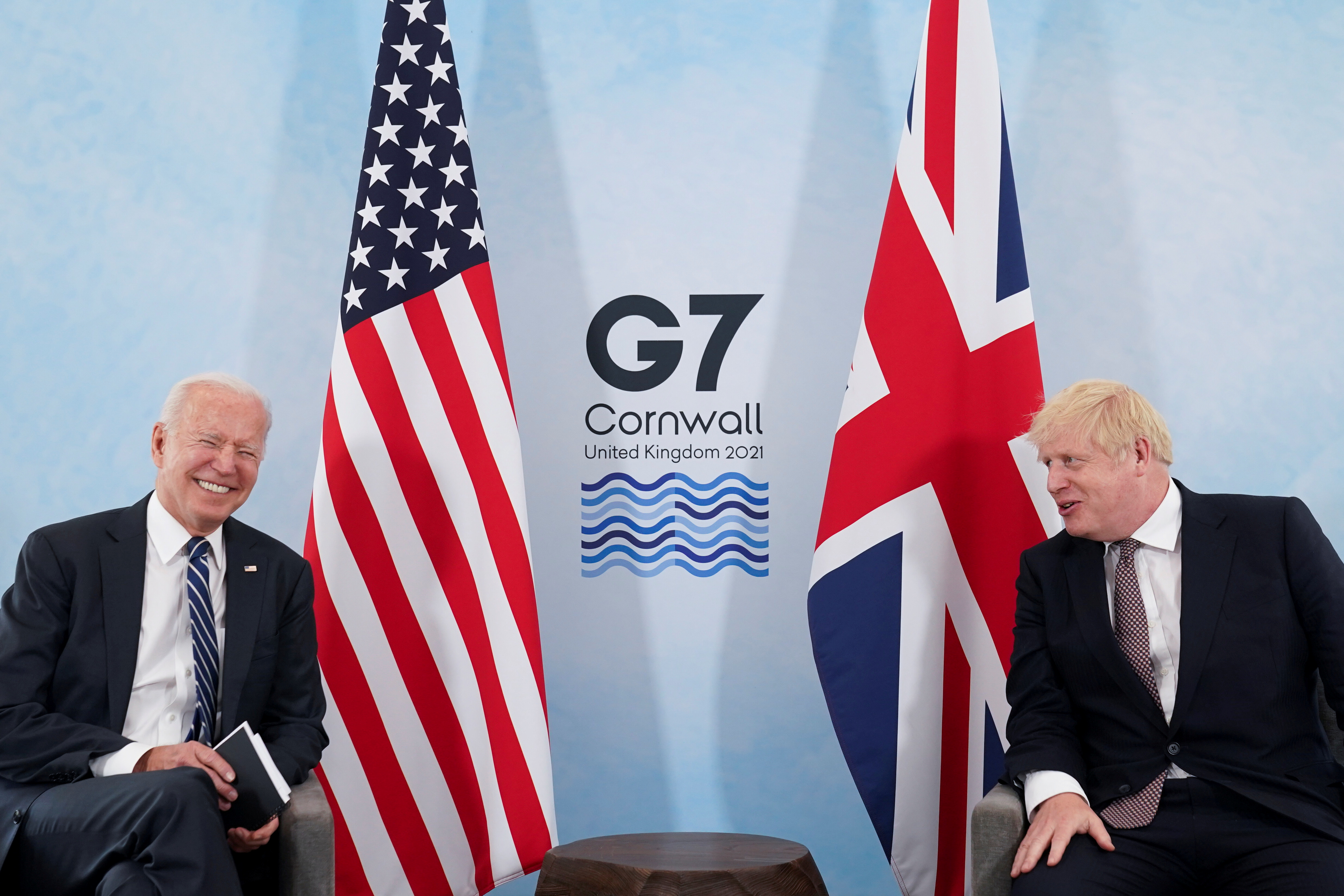 U.S. President Joe Biden laughs while speaking with Britain's Prime Minister Boris Johnson during their meeting, ahead of the G7 summit, at Carbis Bay, Cornwall, Britain June 10, 2021REUTERS/Kevin Lamarque