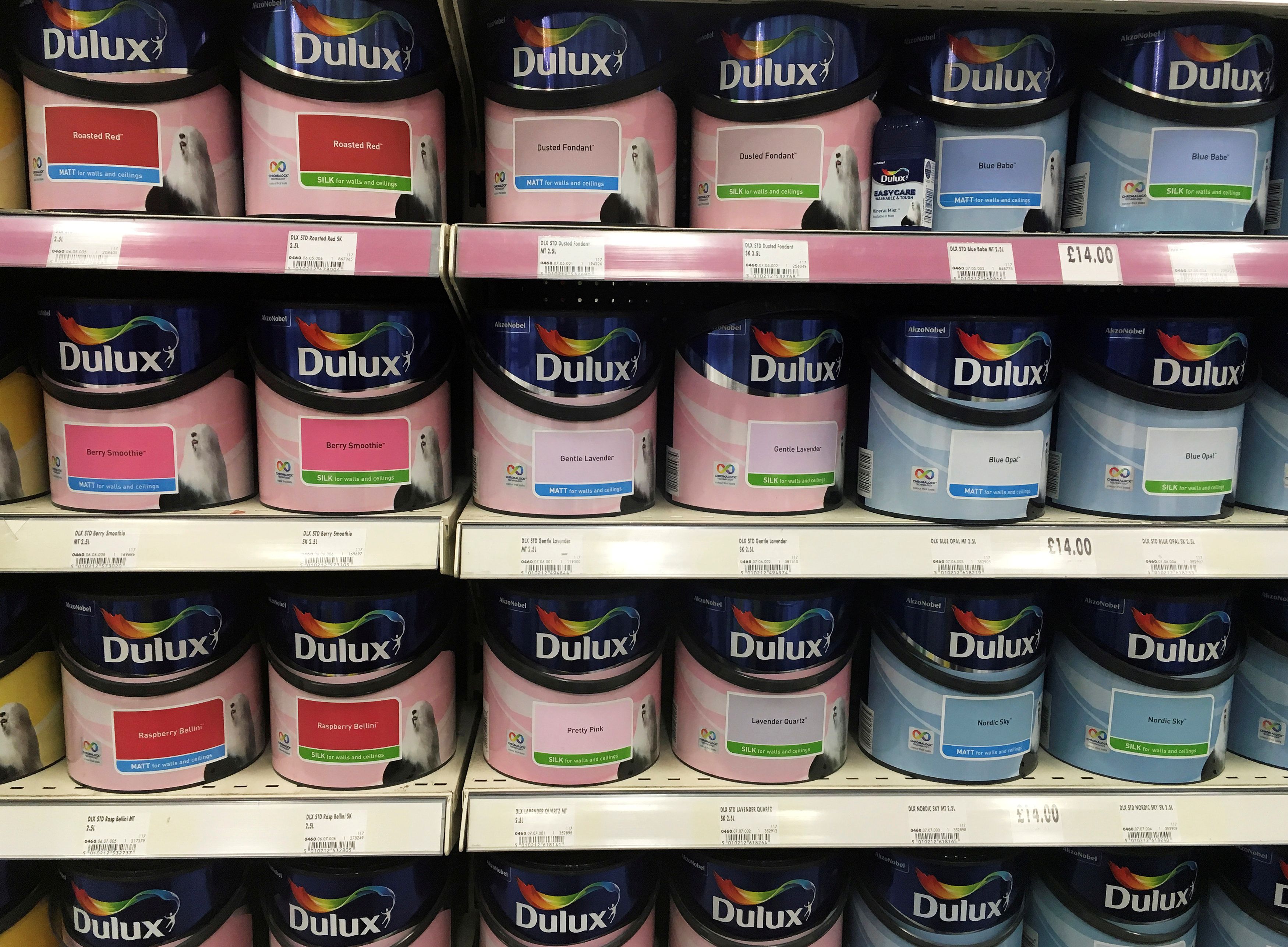 Cans of Dulux paint, an Akzo Nobel brand, are seen on the shelves of a hardware store near Manchester, Britain.