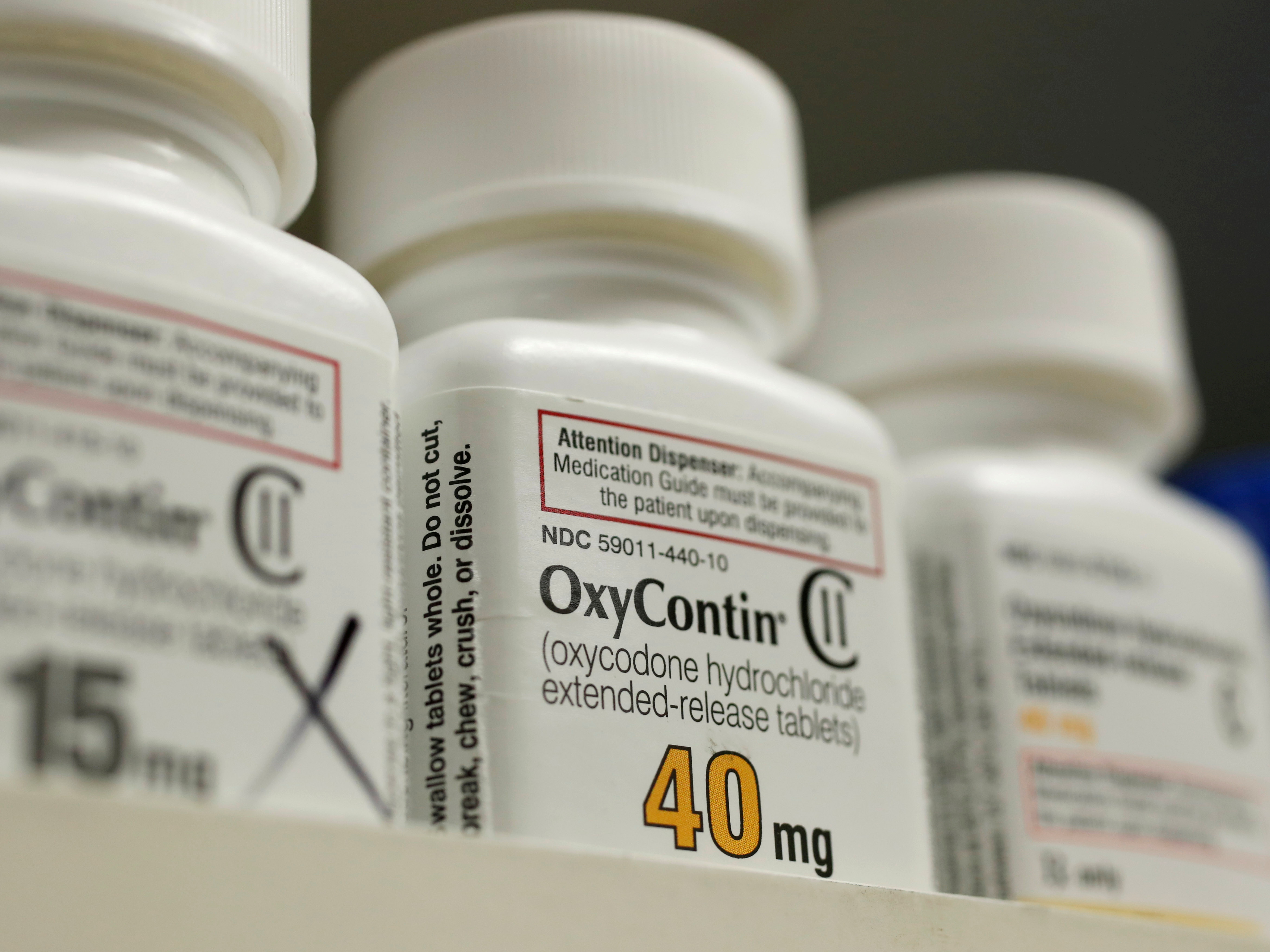 Bottles of prescription painkiller OxyContin made by Purdue Pharma LP sit on a shelf at a local pharmacy in Provo