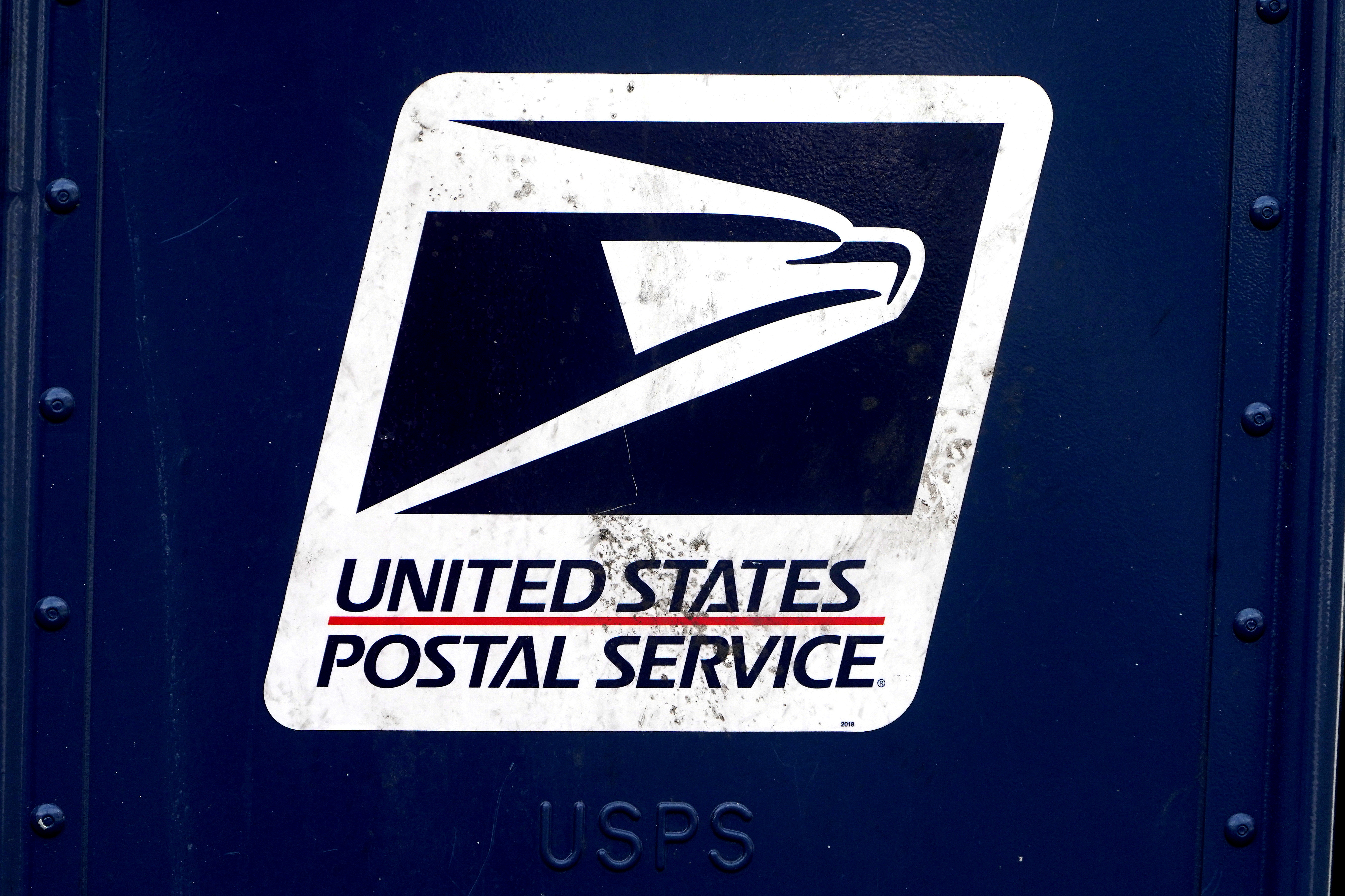 A U.S. Postal Service (USPS) logo is pictured on a mail box in the Manhattan borough of New York City, New York, U.S., August 21, 2020. REUTERS/Carlo Allegri/File Photo