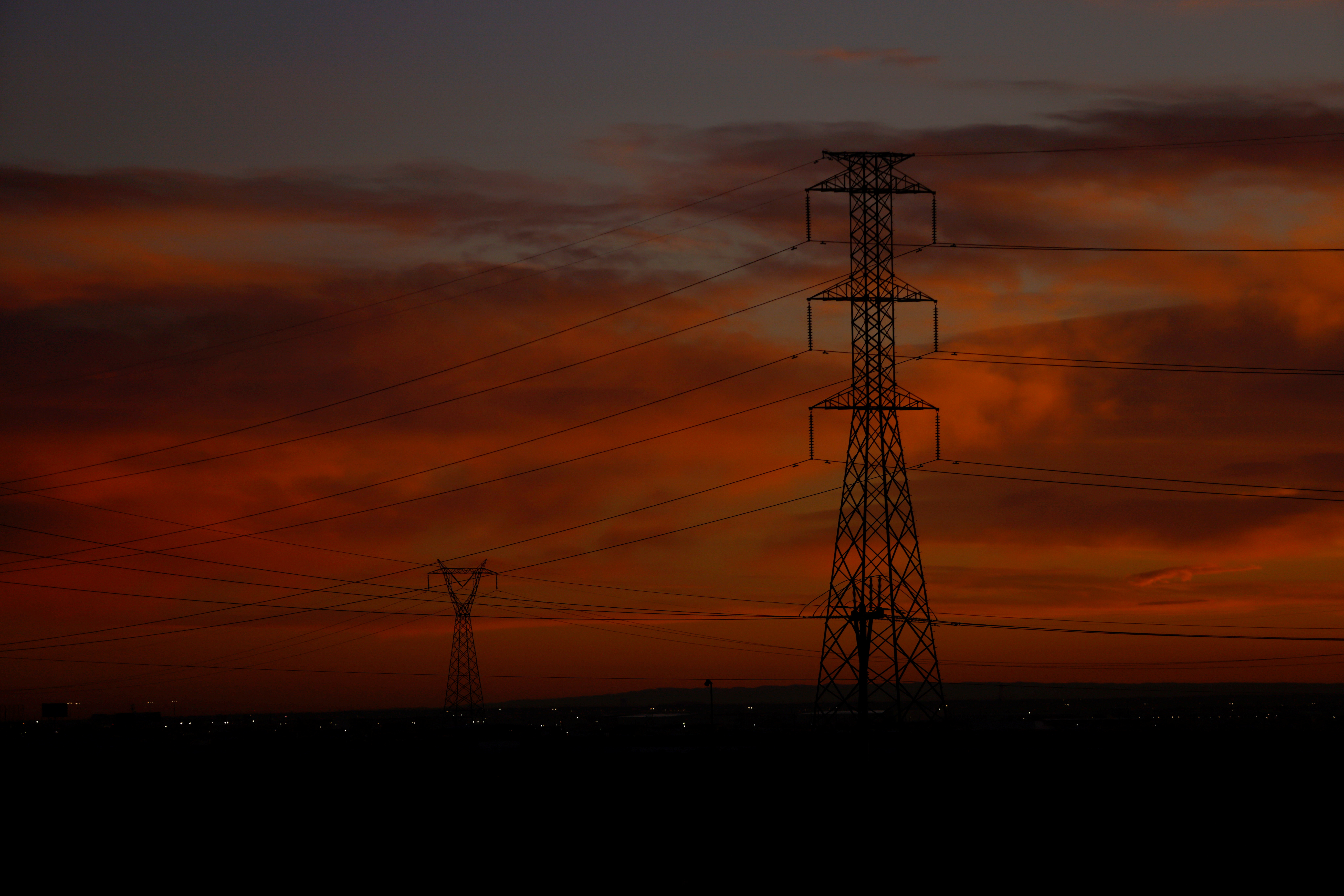 High voltage electricity towers are seen at sunrise in Ciudad Juarez