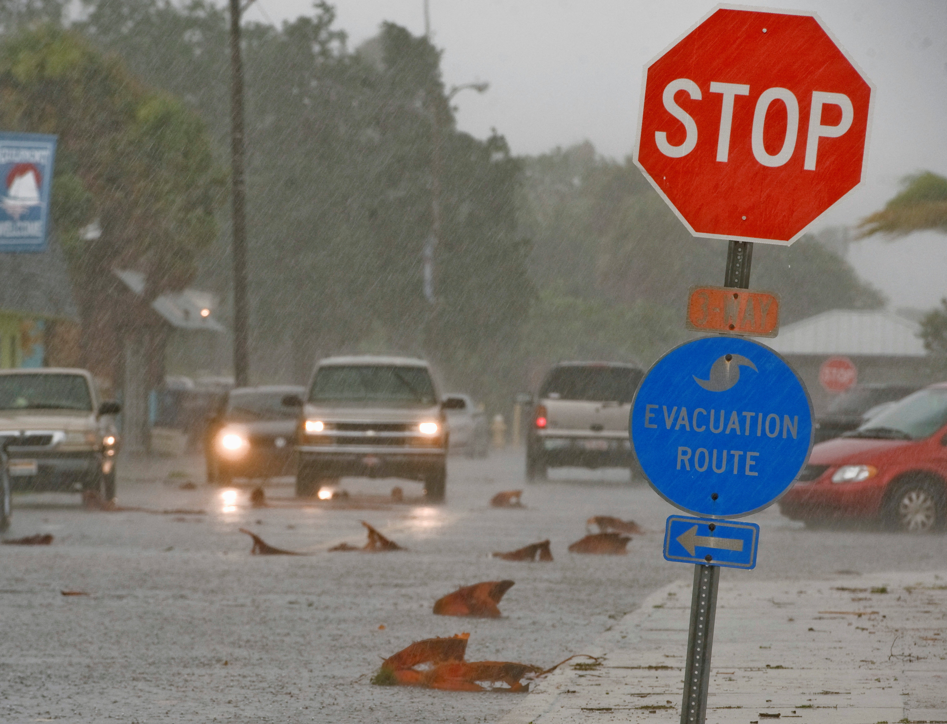 Vehicles drive down Shore Boulevard as wind and rain from Tropical Storm Andrea hit the Florida coast near Gulfport, Florida
