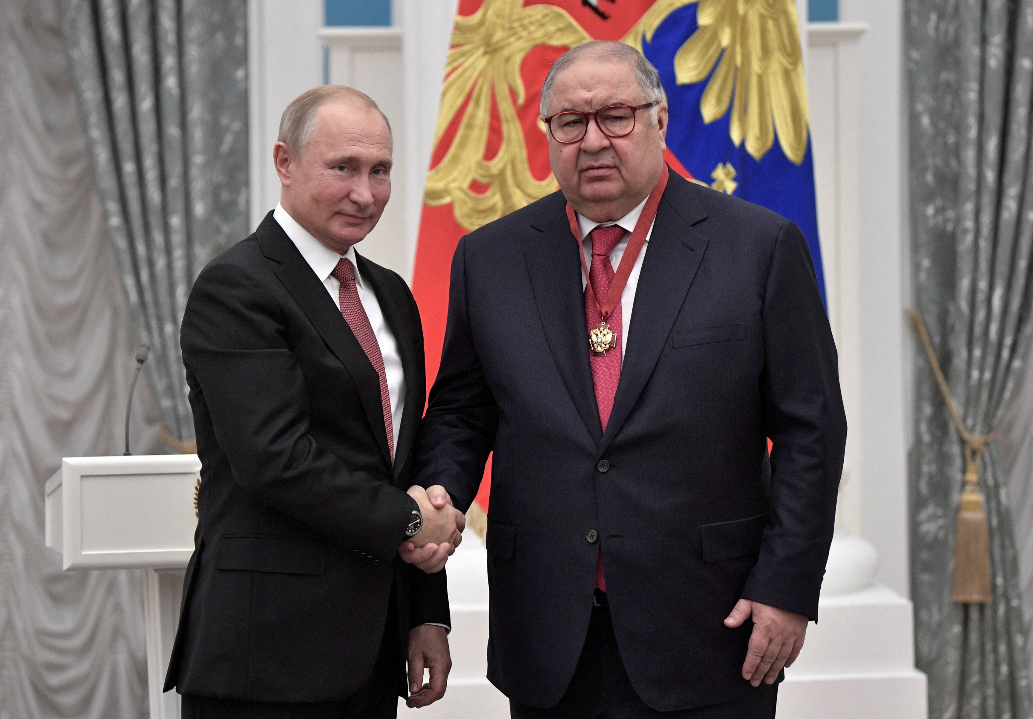 Russian President Putin and Russian businessman Usmanov attend an awarding ceremony in Moscow