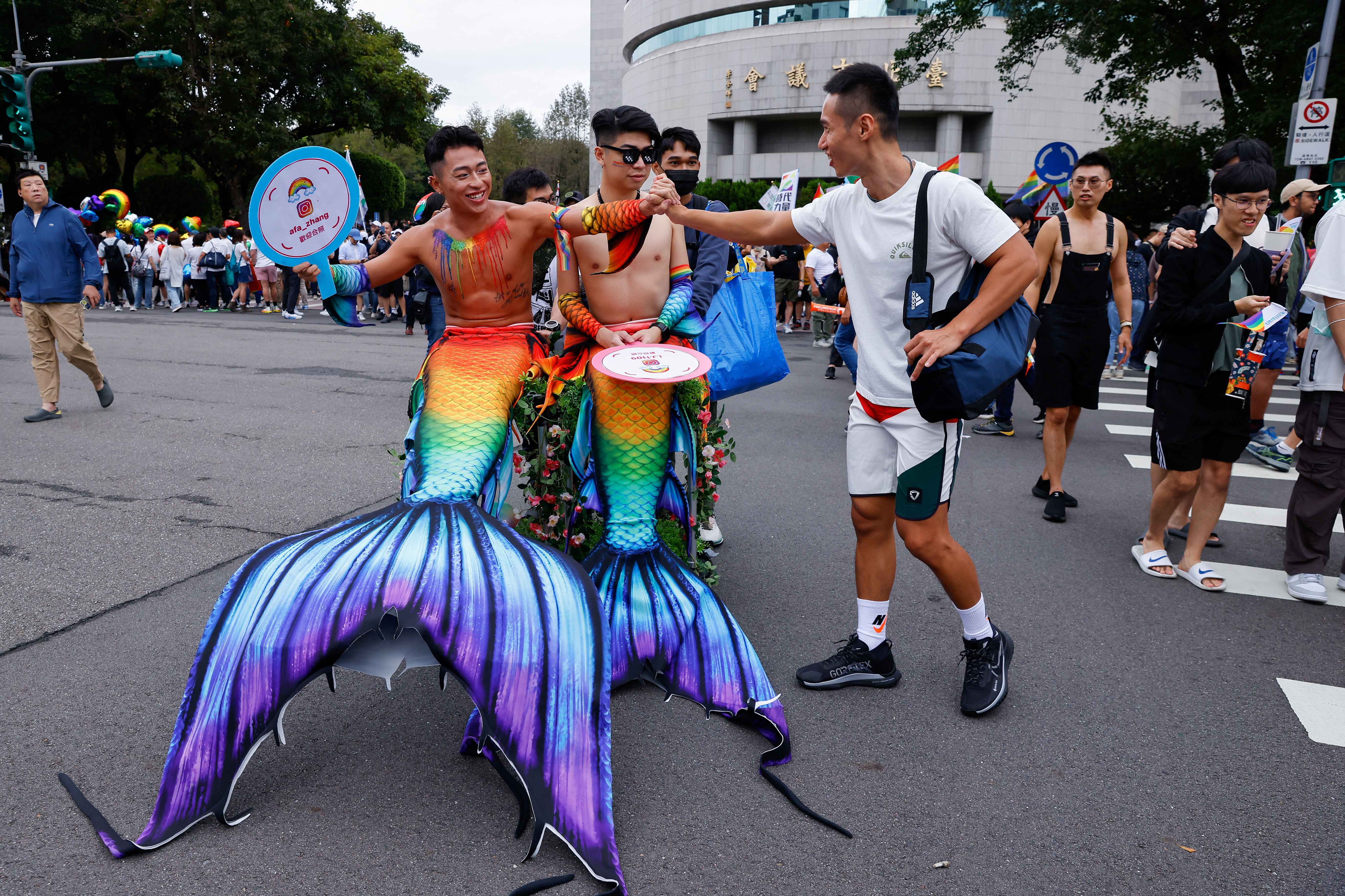 Friends greet each other at the annual Taiwan's Pride parade in Taipei