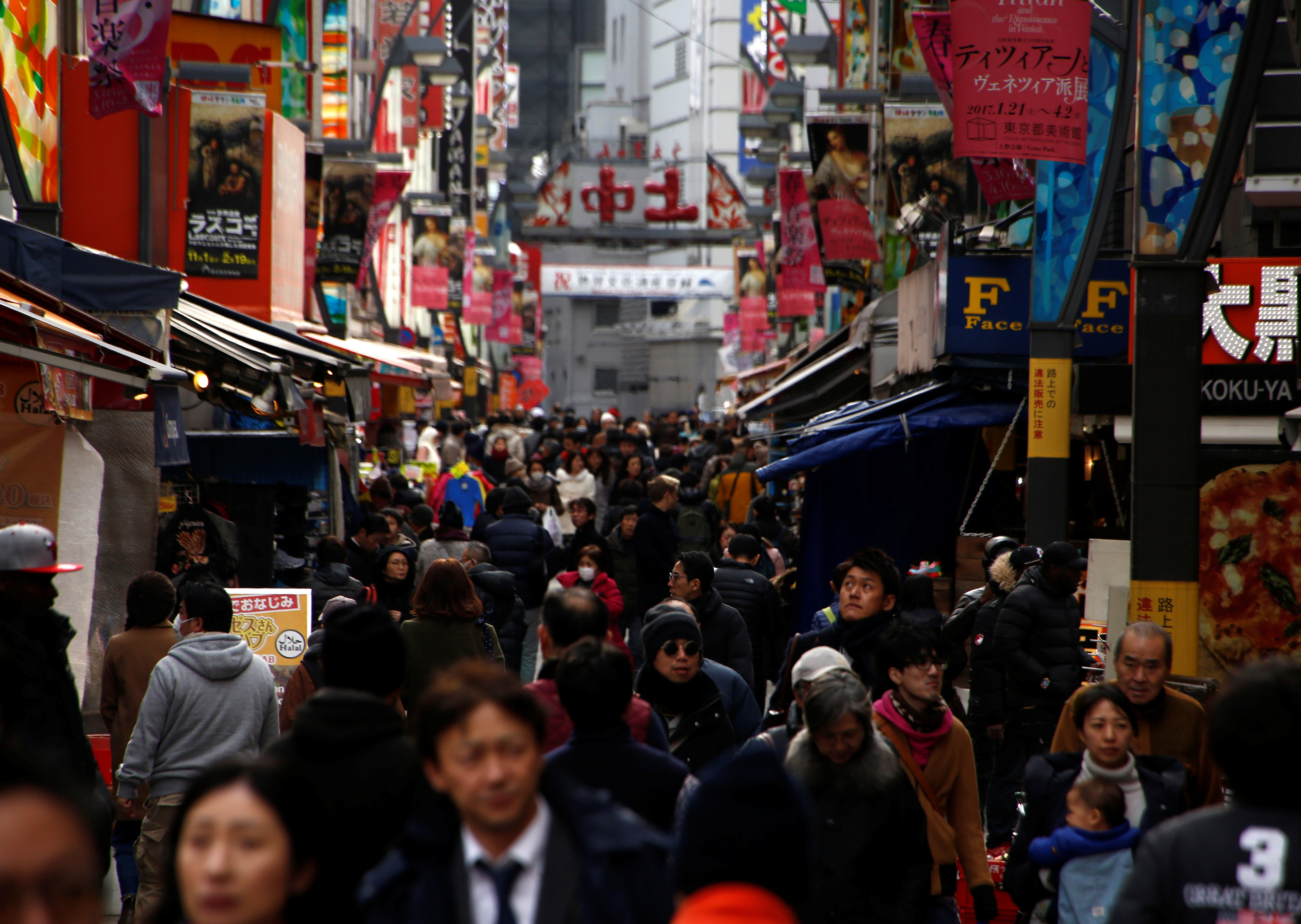 People are seen at a market street in Tokyo