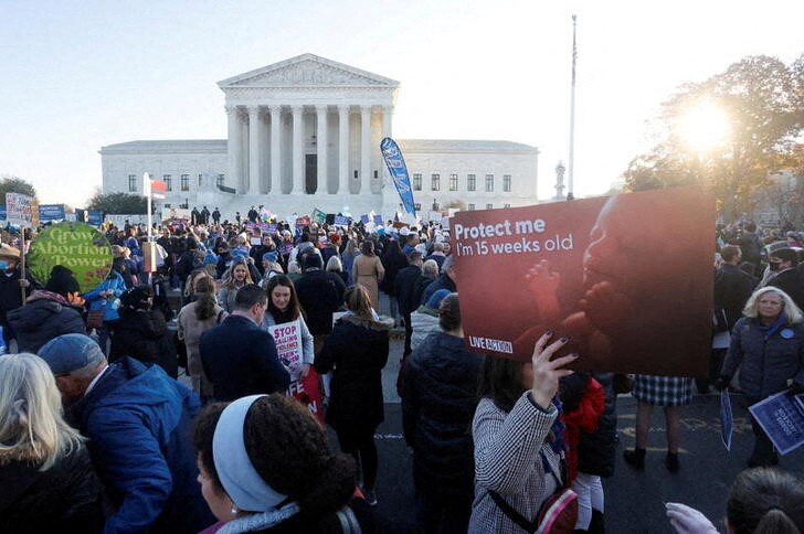 Anti-abortion and pro-abortion rights protesters gather outside Supreme Court in Washington