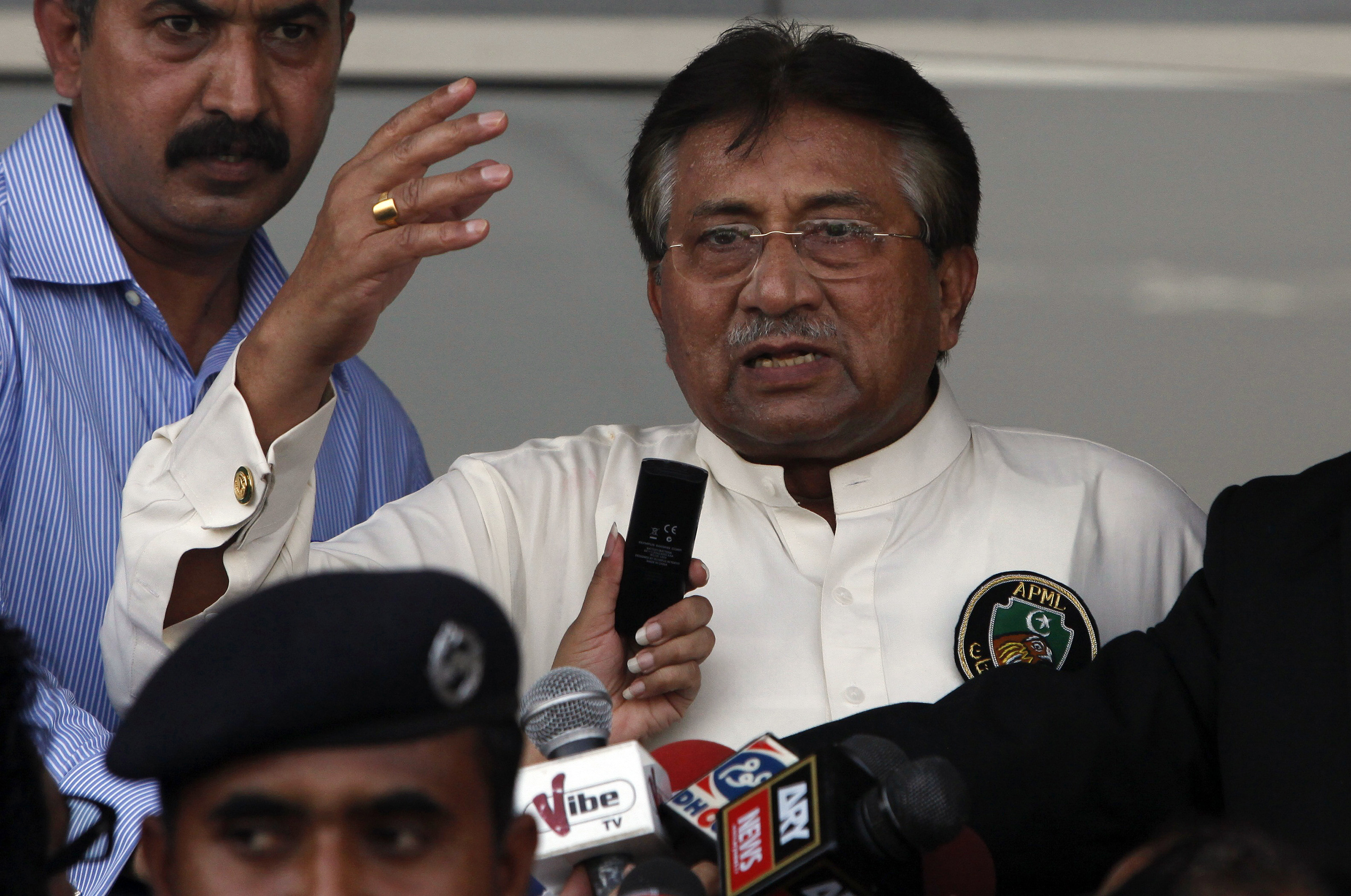 Pakistan's former President, Pervez Musharraf, addresses his supporters after his arrival from Dubai at Jinnah International airport in Karachi