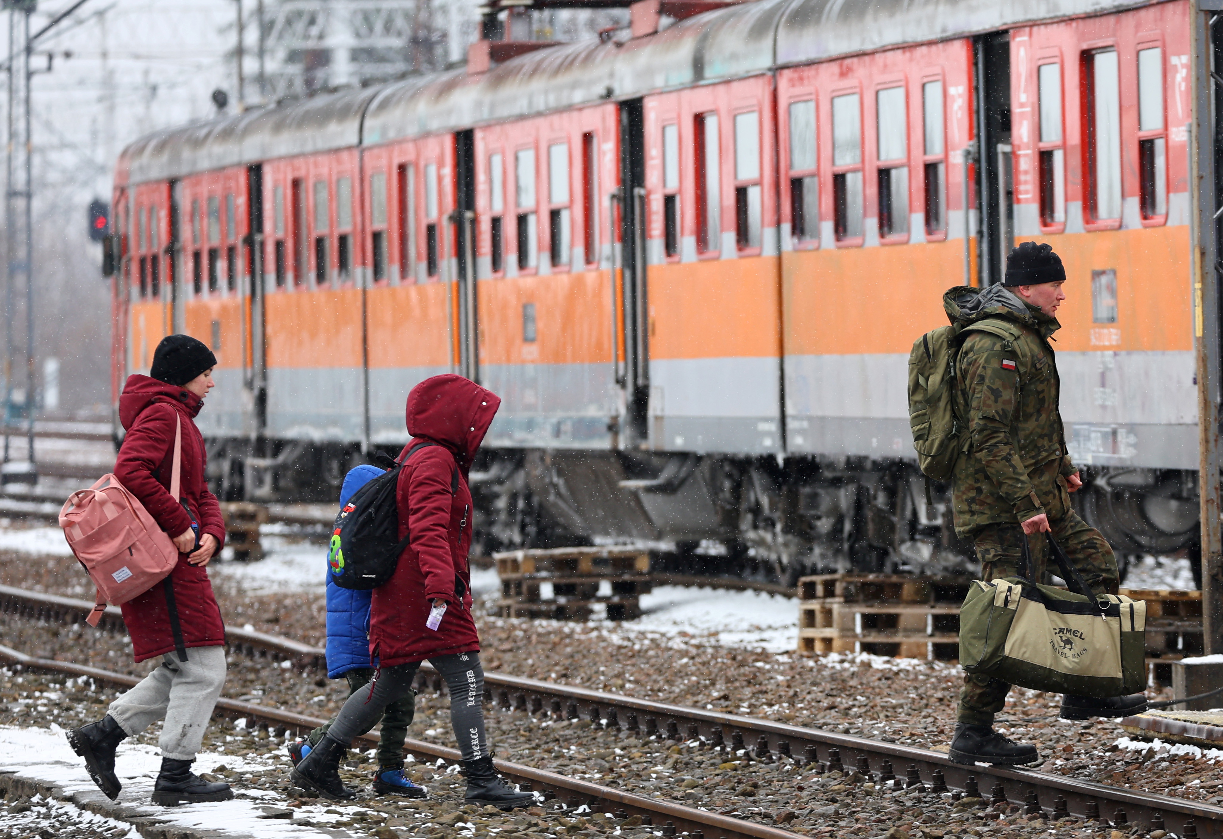 People fleeing Russia's invasion of Ukraine arrive at the border checkpoint in Medyka