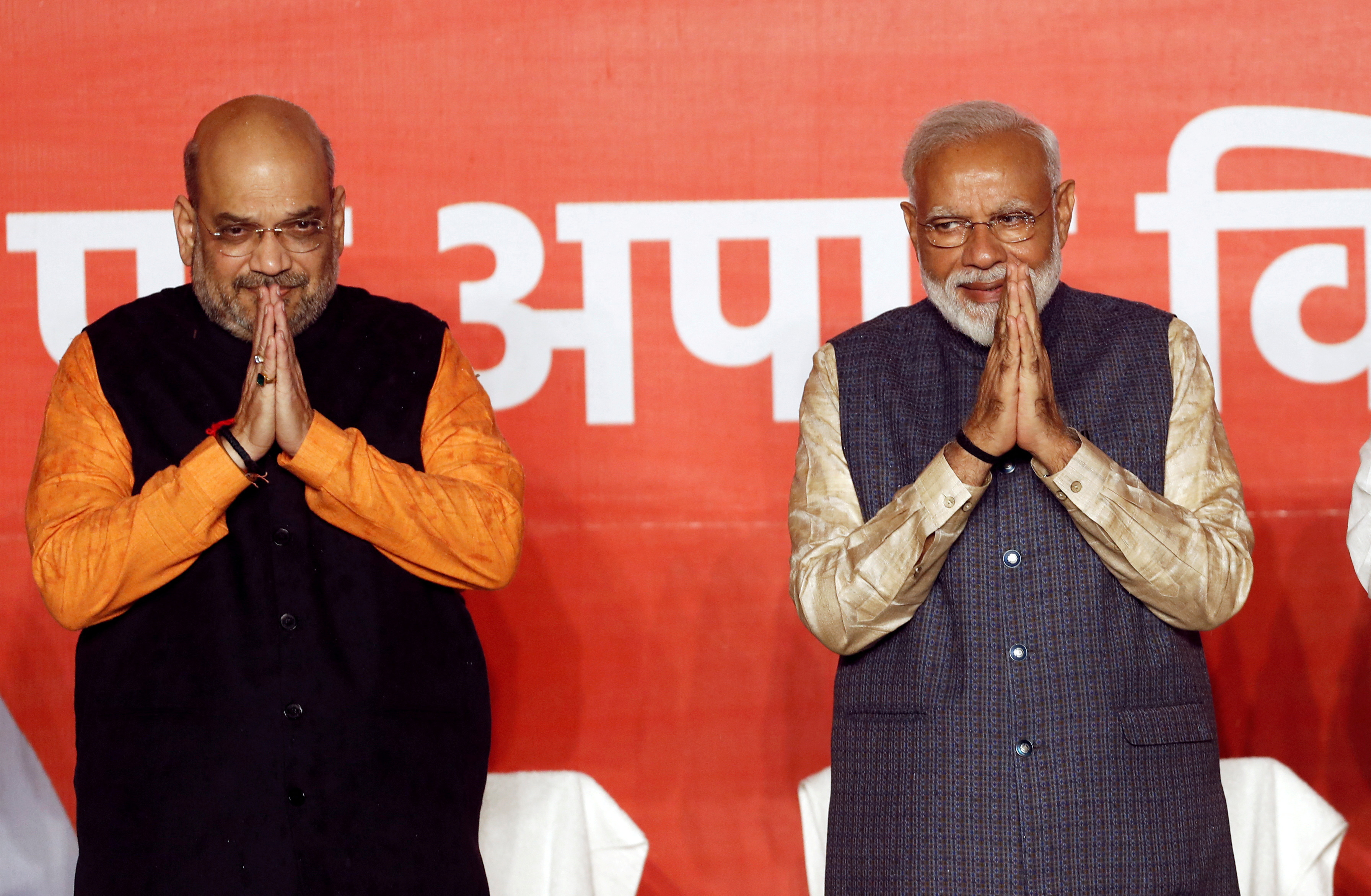 BJP President Amit Shah and Indian Prime Minister Narendra Modi gesture after the election results in New Delhi