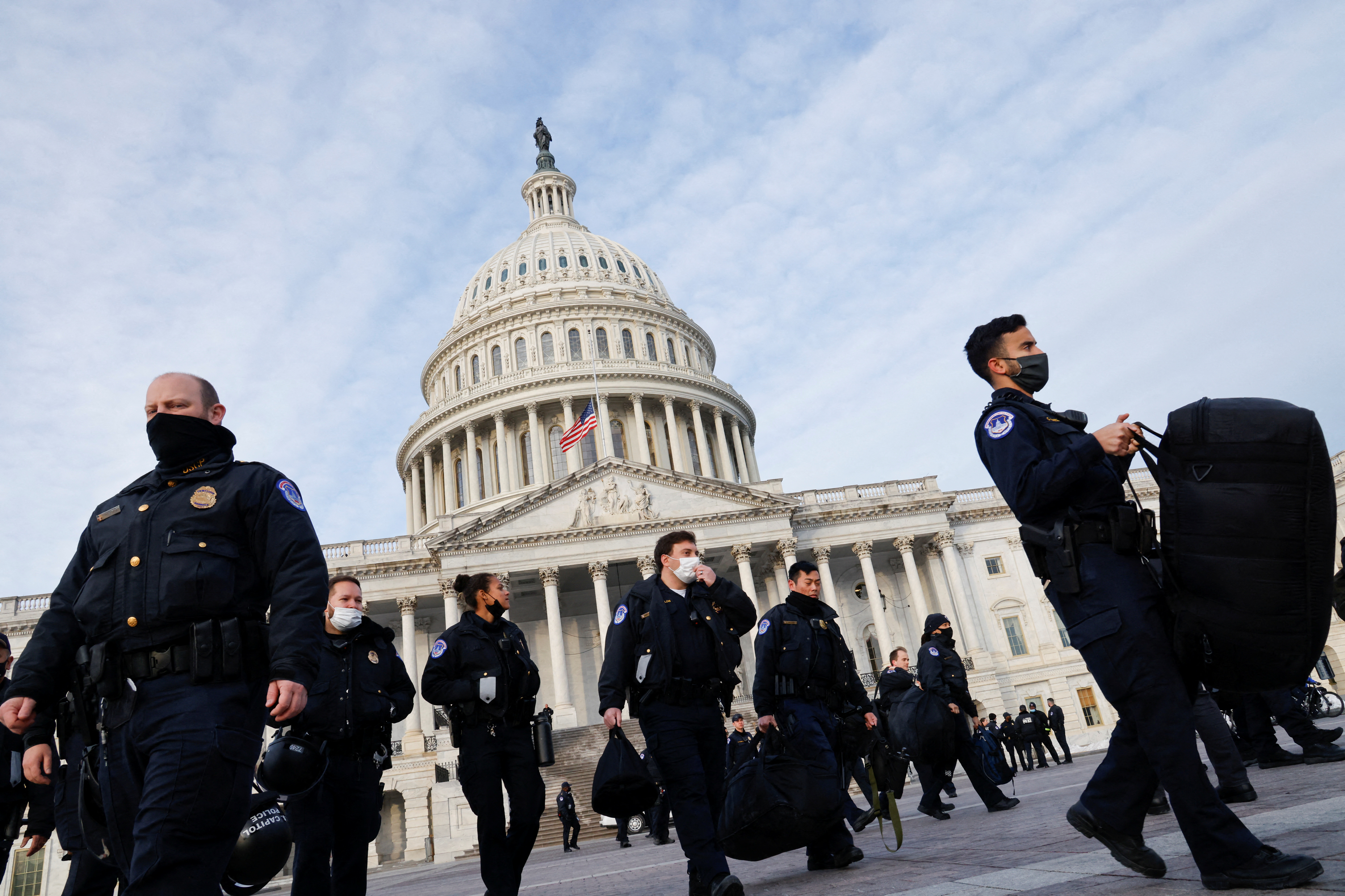 U.S. Capitol Police members walk in front of the U.S. Capitol on the first anniversary of the January 6, 2021 attack on the Capitol by supporters of former President Donald Trump, on Capitol Hill in Washington, U.S., January 6, 2022. REUTERS/Jonathan Ernst