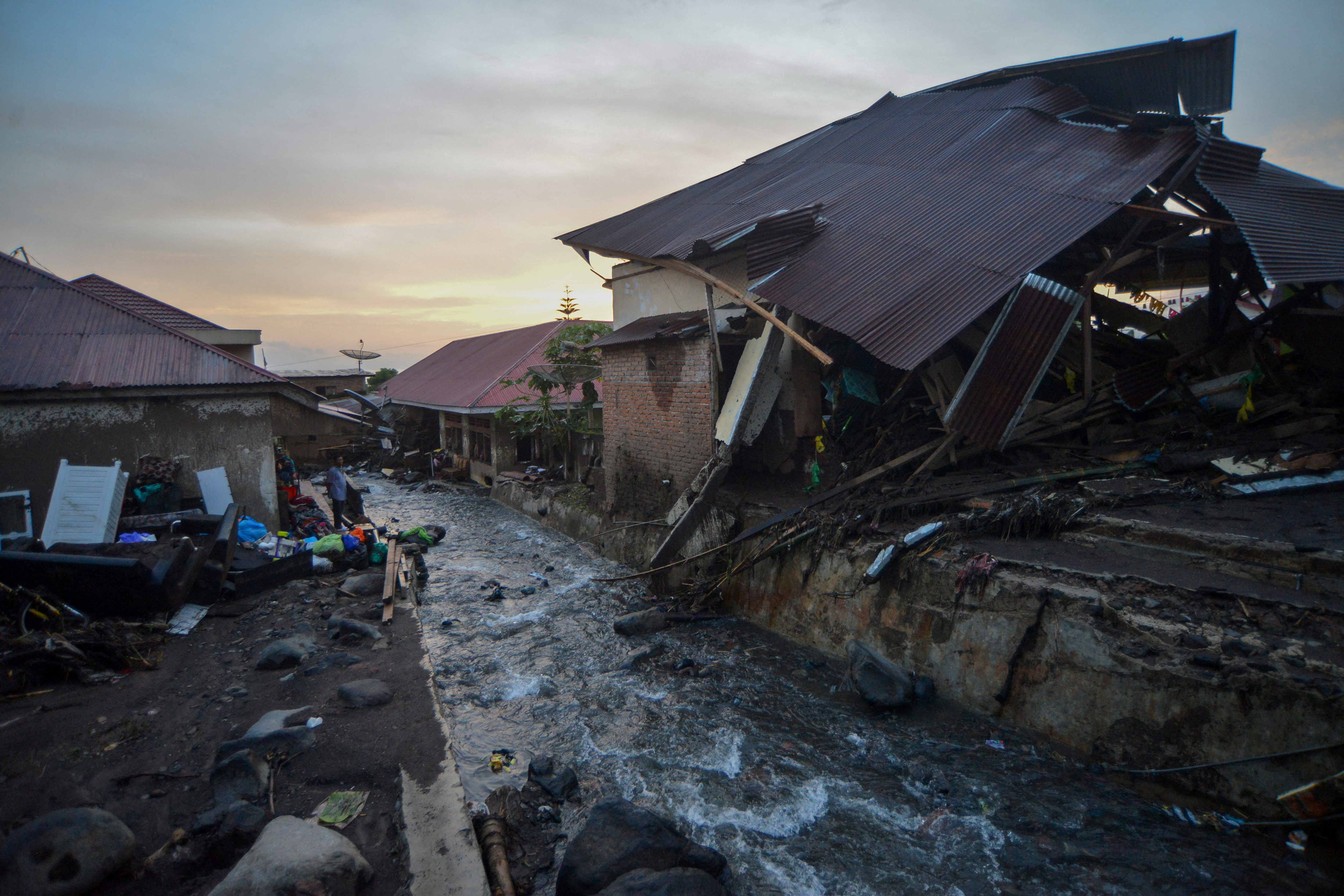 A damaged house is seen in an area affected by heavy rain which caused flash floods in Agam