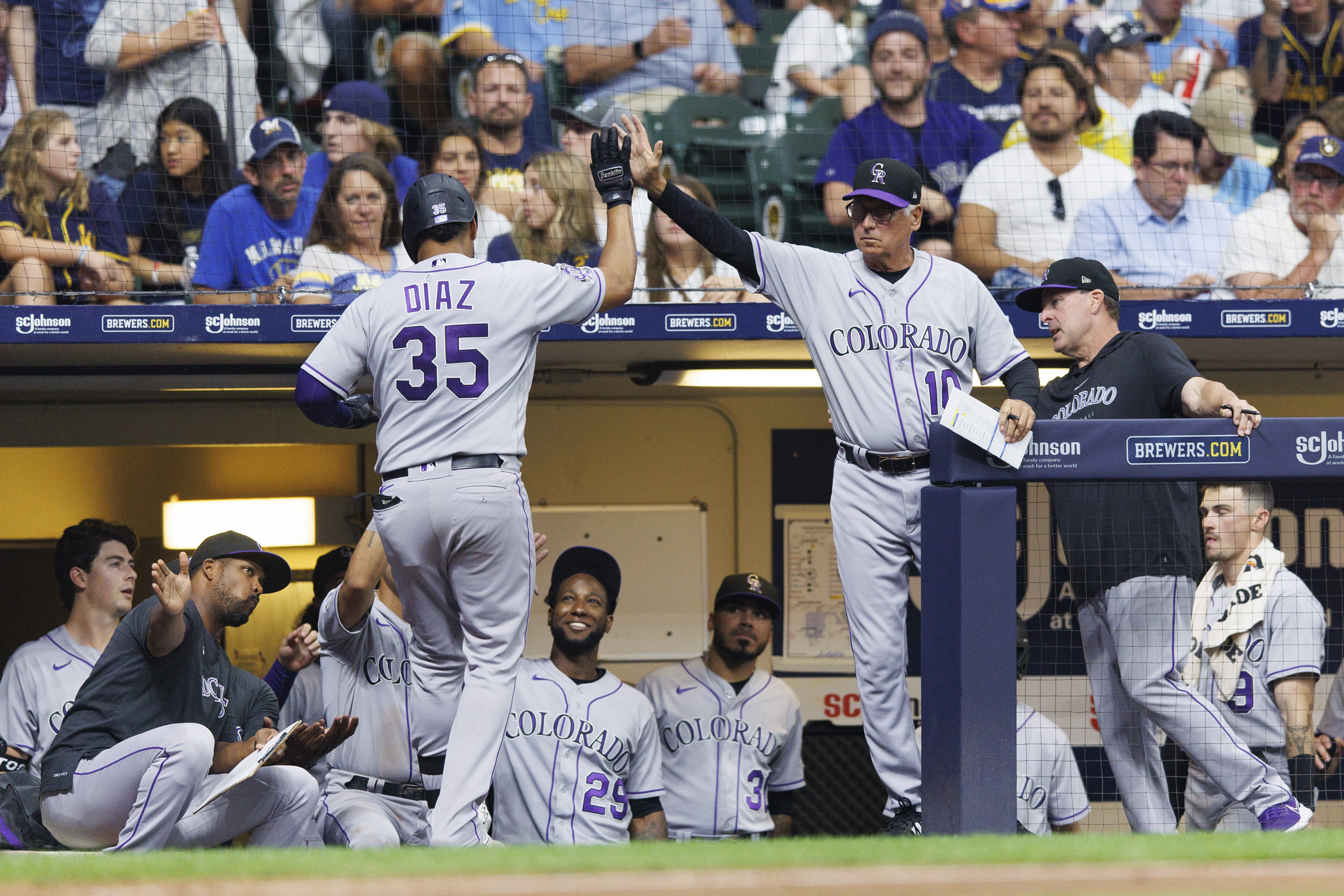 Rockies walk to bizarre, 7-4, 10-inning win over Brewers