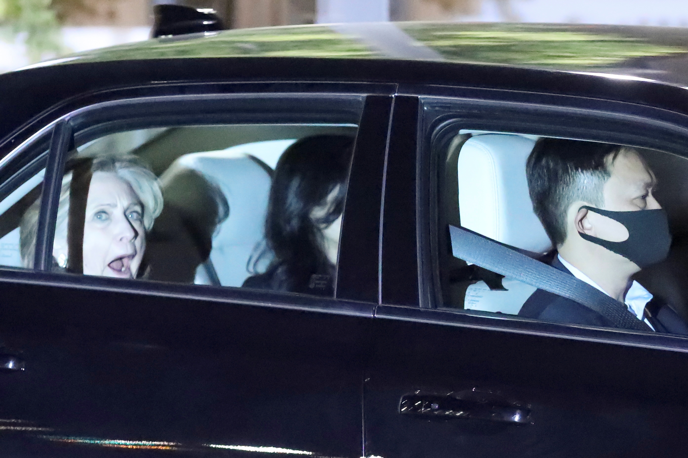 Hillary Clinton leaves in a car after it was announced that former U.S. President Bill Clinton was admitted to the University of California Irvine Medical Center in Orange