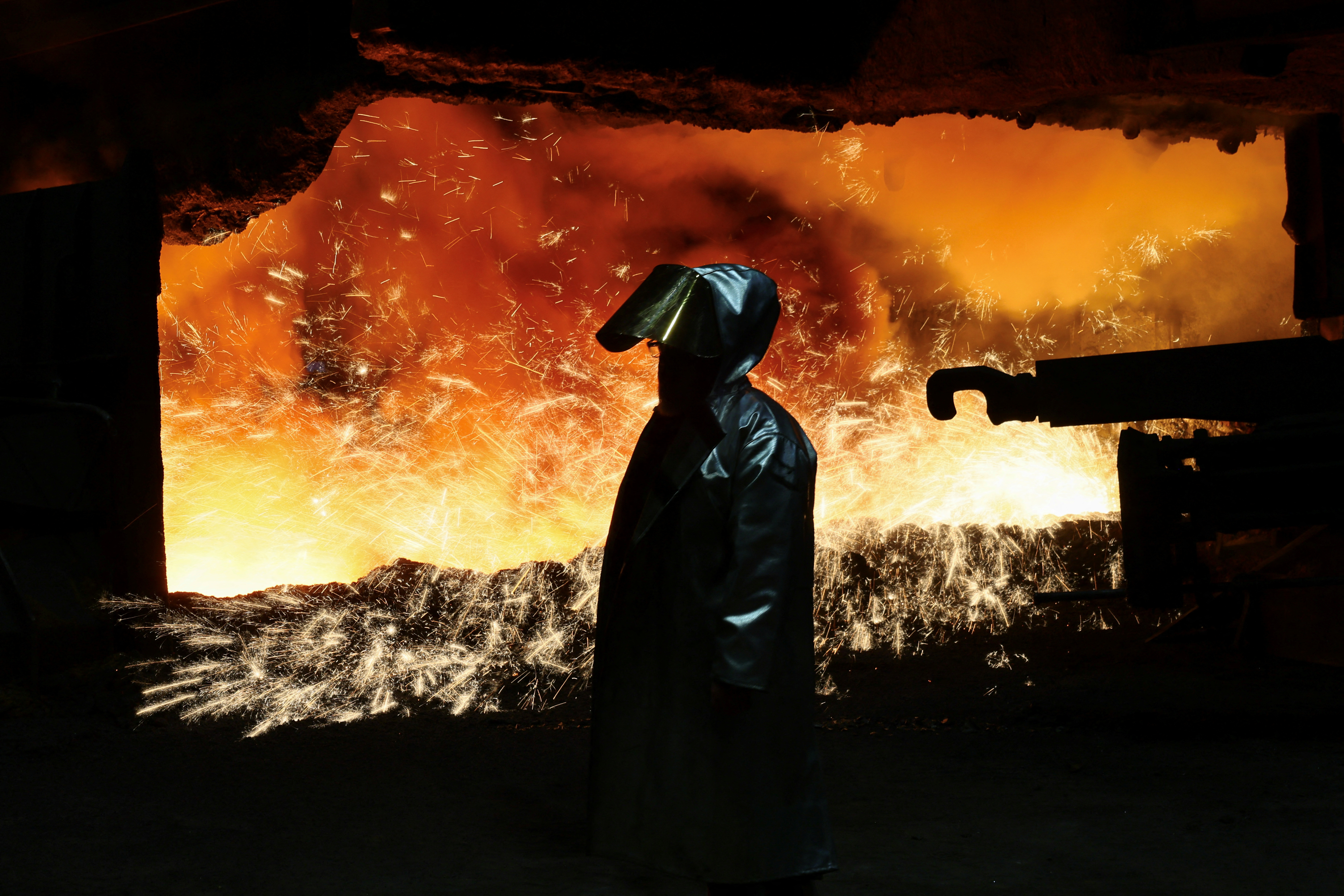 Steel worker at furnace of ThyssenKrupp's steel plant in Duisburg