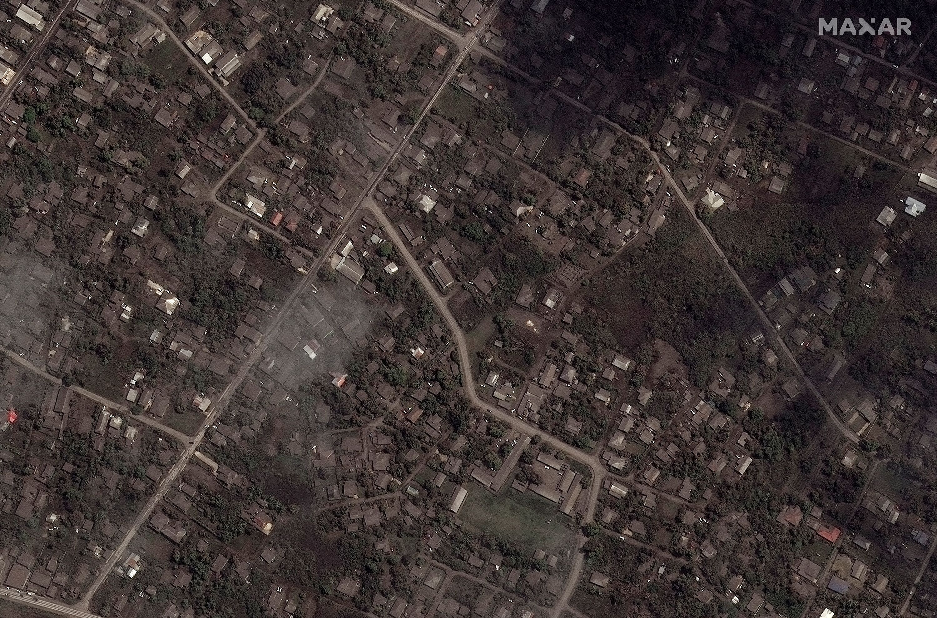 A satellite image shows ash covered homes and buildings after the main eruption of the Hunga Tonga-Hunga Ha'apai volcano, in Nuku'alofa