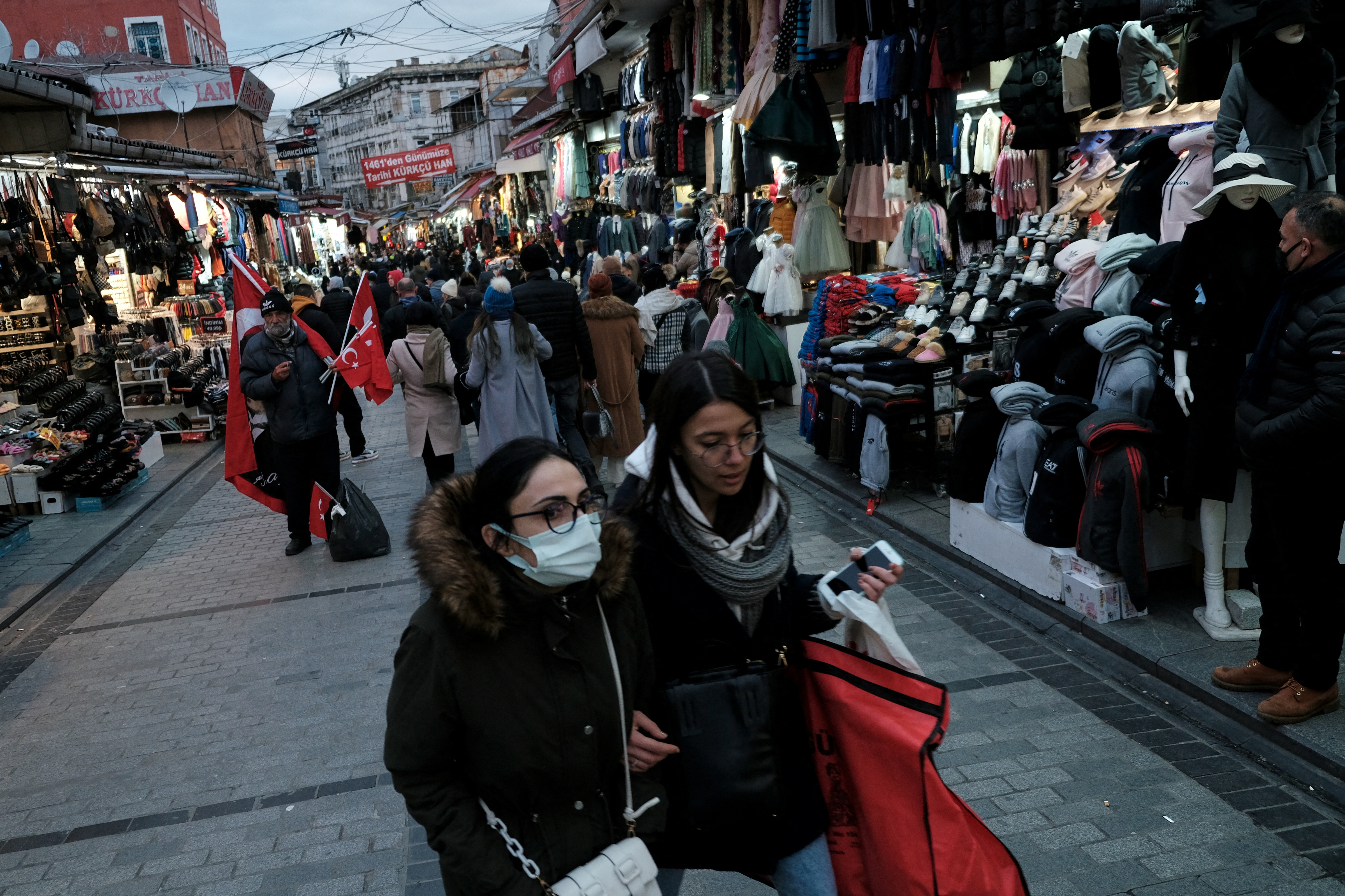 People stroll at Mahmutpasa street, a popular middle-class shopping area in Istanbul