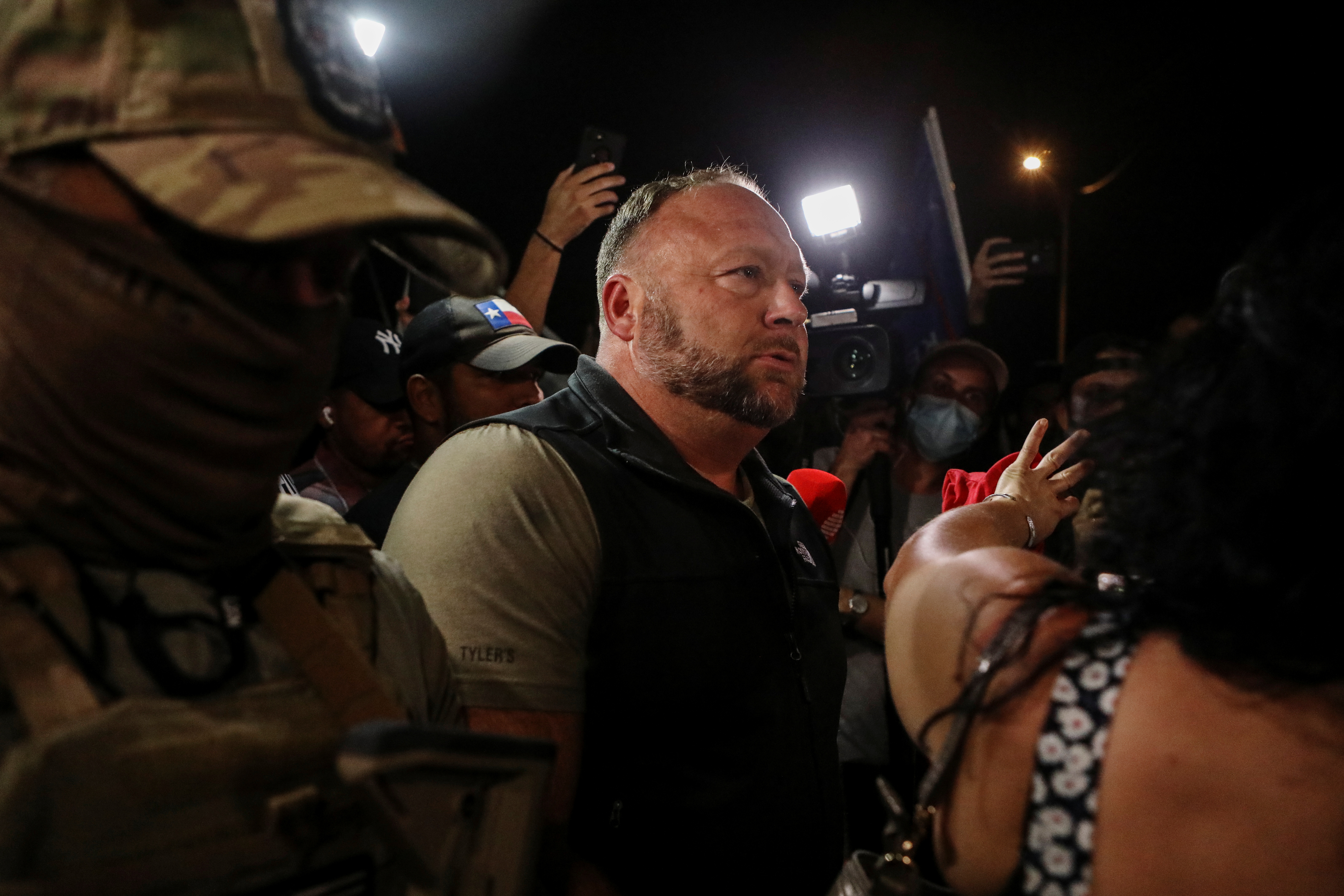 Alex Jones of Infowars looks on as supporters of U.S. President Donald Trump gather during a protest about the early results of the 2020 presidential election in Phoenix, Arizona, U.S., November 5, 2020. REUTERS/Jim Urquhart