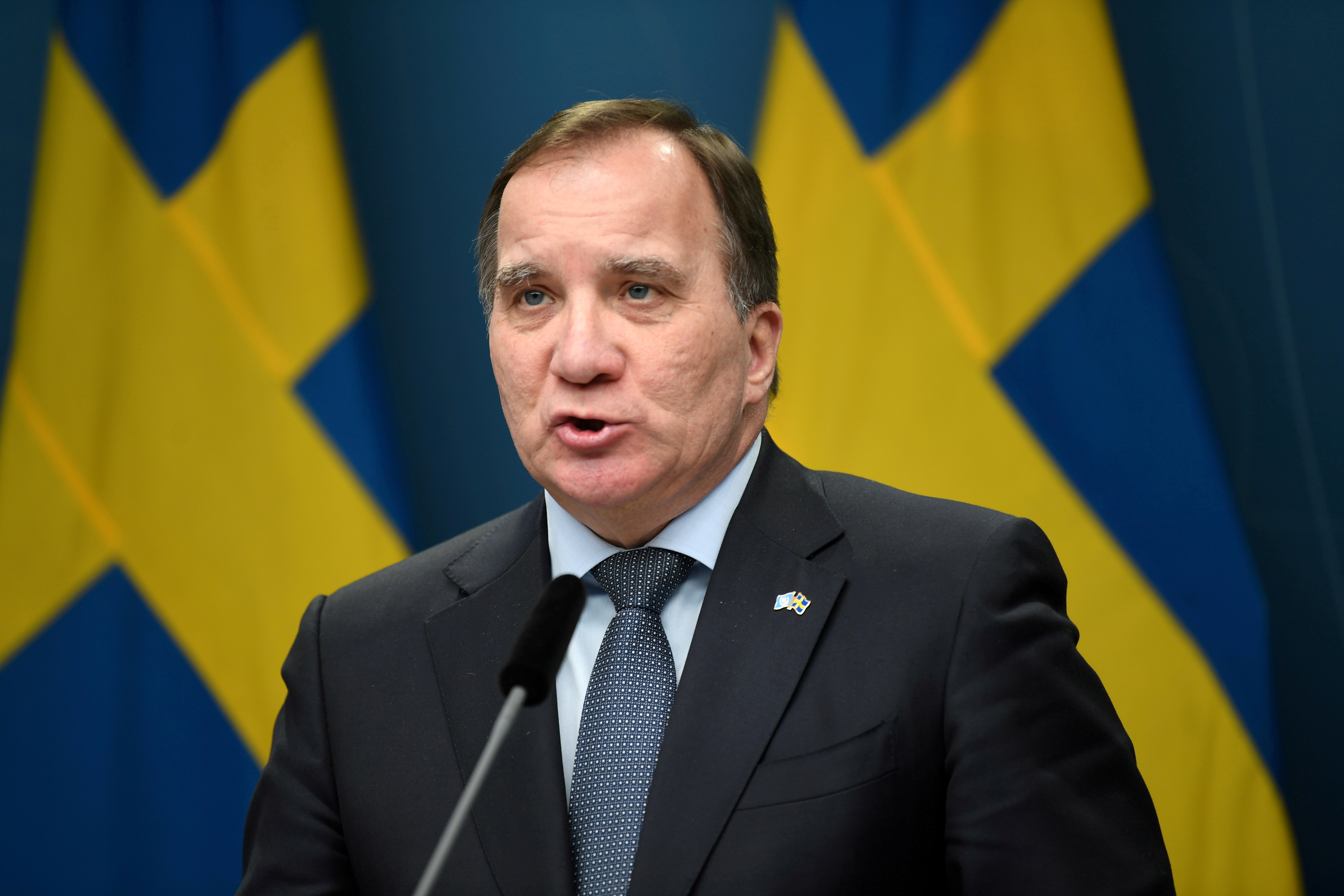 Swedish Prime Minister Stefan Lofven holds a news conference after parliament passes a bill to slow the COVID-19 pandemic