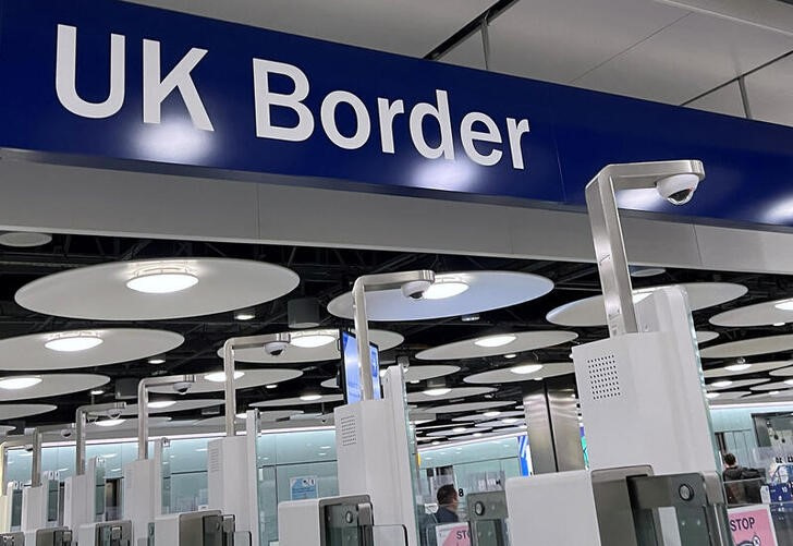 A sign is seen at passport control area of Terminal 5, at Heathrow Airport, London