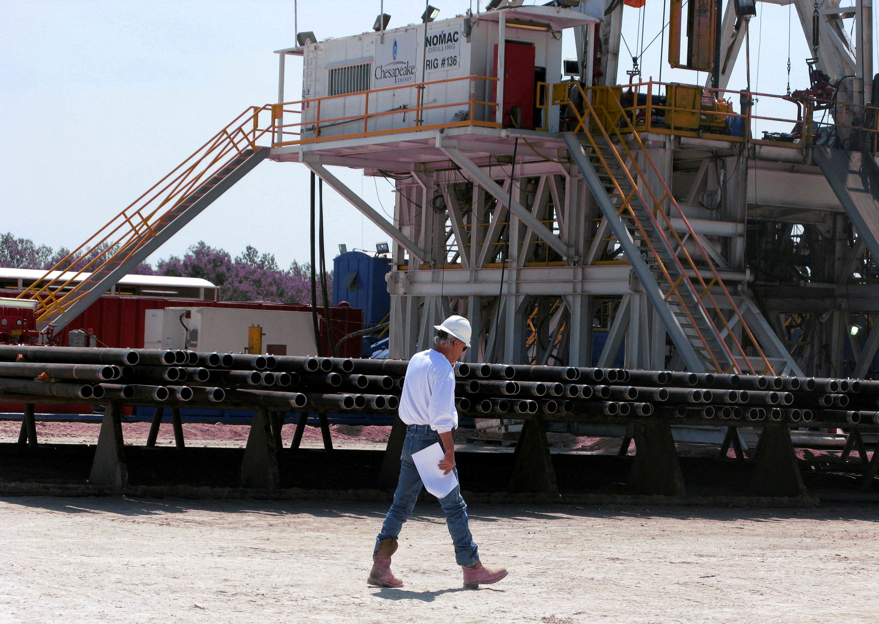A Chesapeake Energy Corp worker at a drilling site on the Eagle Ford shale near Crystal City, Texas