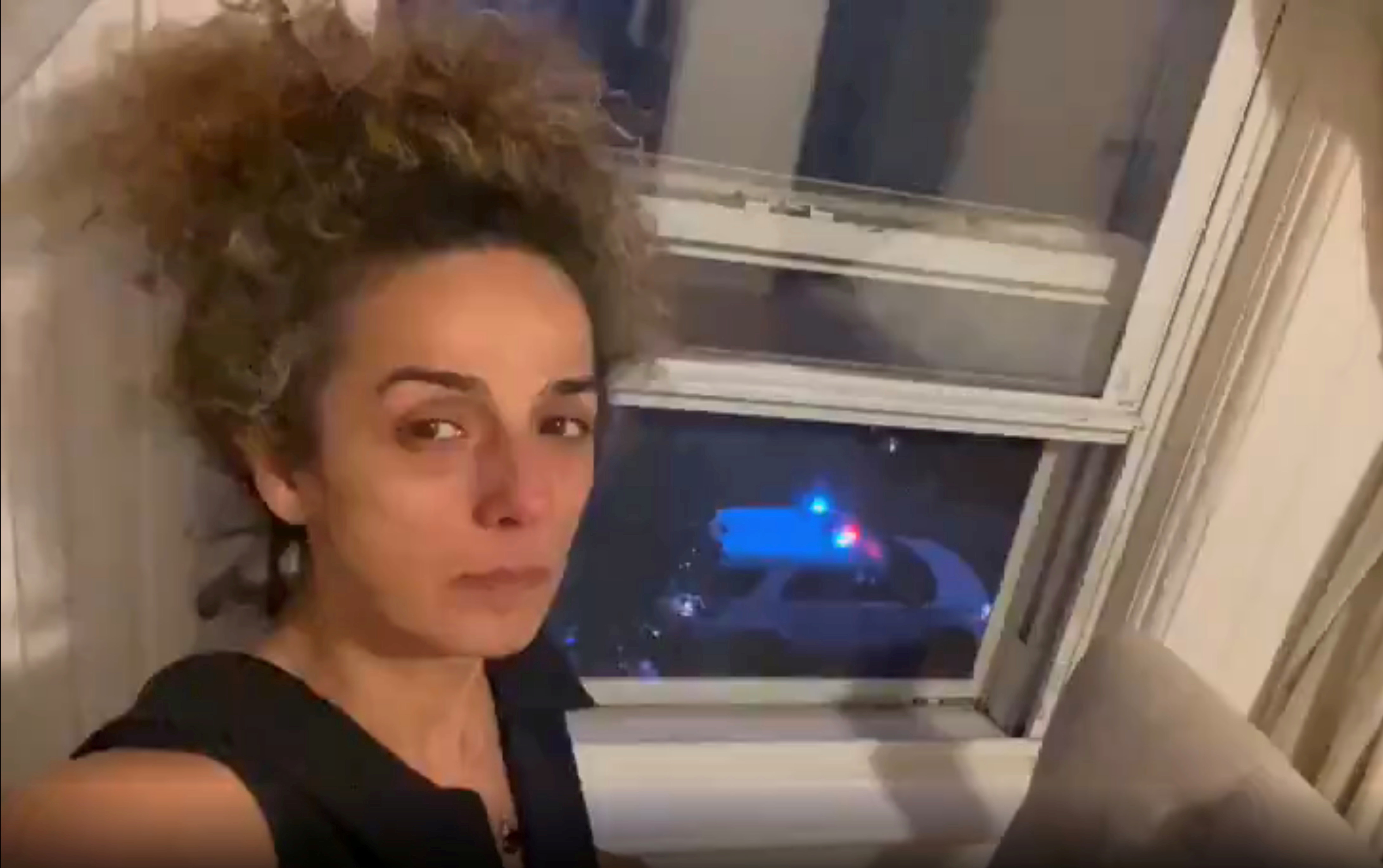 Iranian American journalist Alinejad Masih shows an FBI car guarding outside her apartment