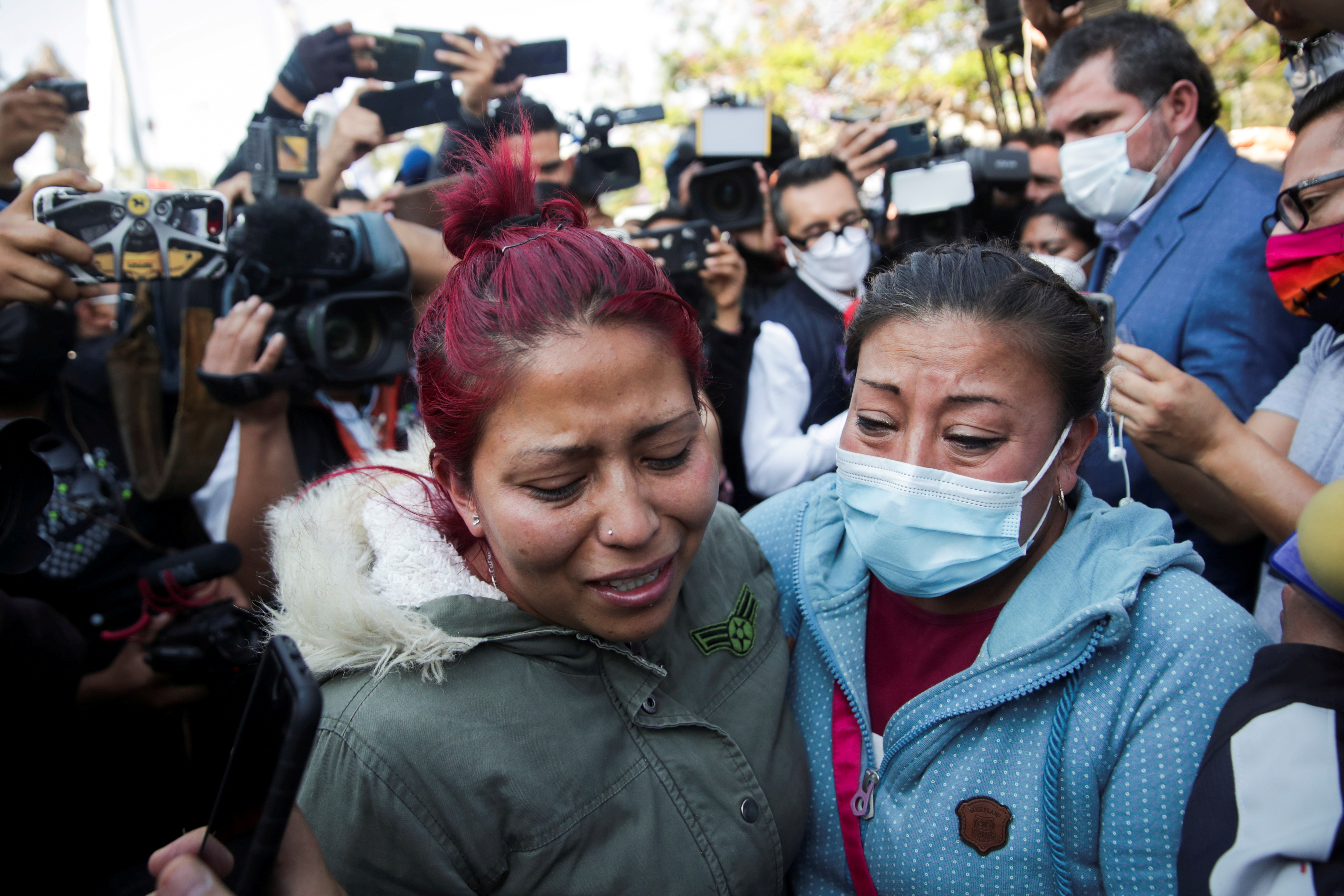 Relatives arrive looking for Brandon Giovani Hernandez Tapia, near the site where an overpass for a metro partially collapsed with train cars on it at Olivos station in Mexico City, Mexico May 4, 2021. REUTERS/Henry Romero